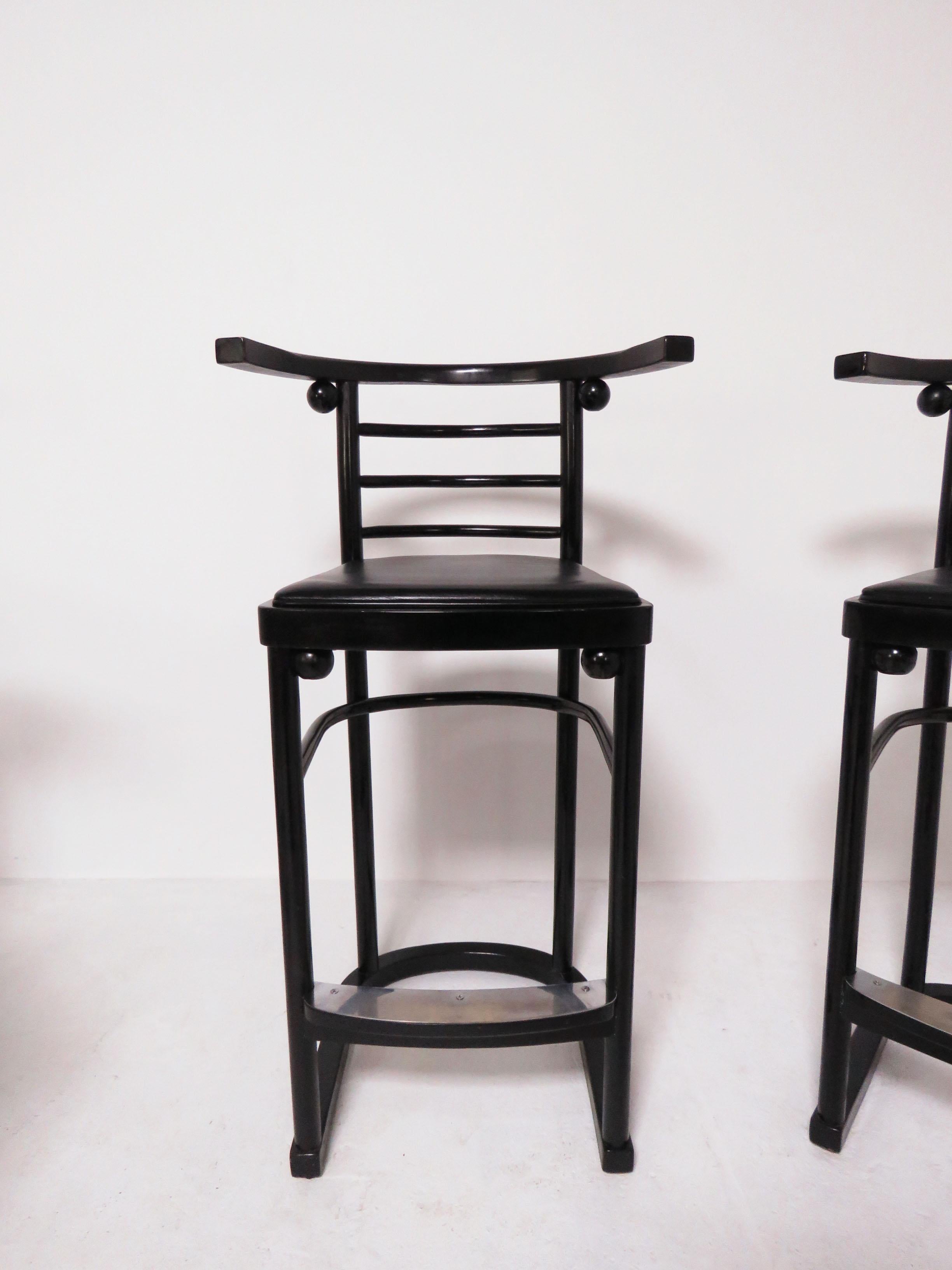 Set of four “Fledermaus” cabaret bar stools with genuine leather seats and stainless steel foot rests. Originally designed by Josef Hoffmann in the early 1900s for Vienna’s famed Fledermaus Cabaret, these are a midcentury 1970s Thonet production.