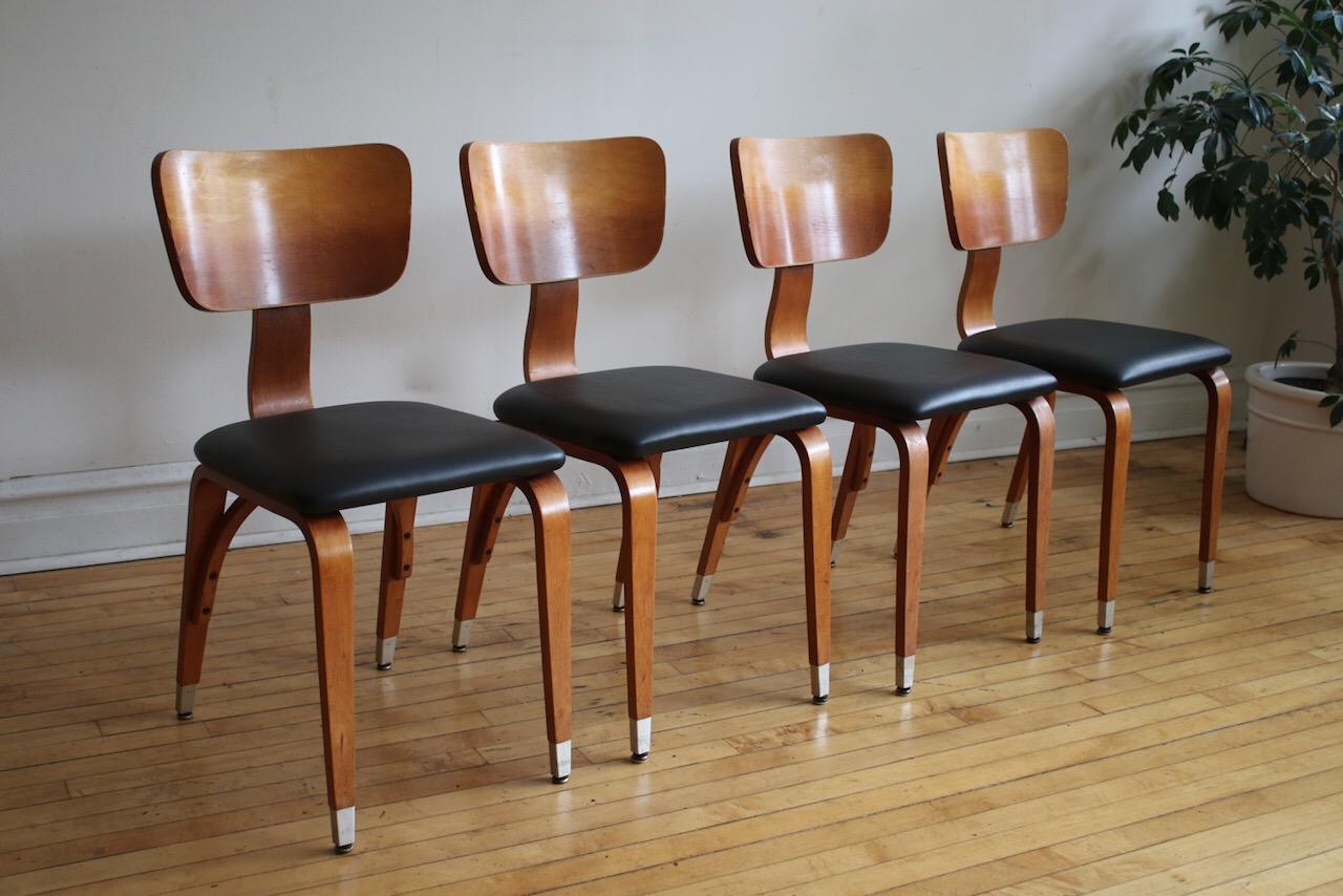 Set of 4 Mid-Century Modern Thonet dining chairs Model #36.
Chairs have new black vinyl upholstery and new foam cushions.
Bentwood backs, legs, and support.
Rock maple. Metal feet.
Thonet Industries was the Pioneer and patent holder of the