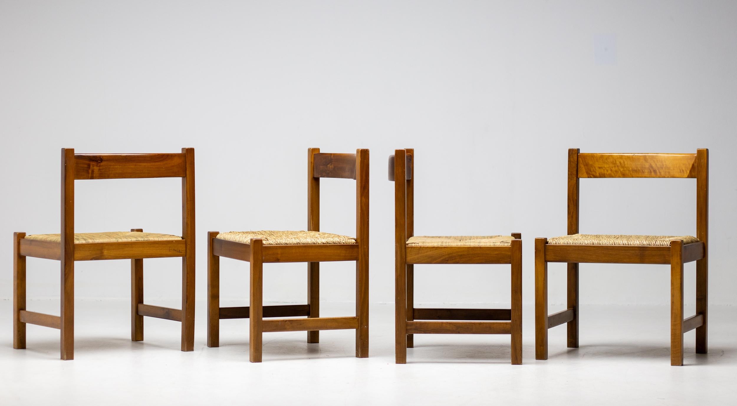 Set of 4 dining chairs from the Torbecchia series, designed by brutalist architect Giovanni Michelucci for Poltronova, 1964.  Solid walnut structure with seats upholstered in cane. 
This architectural set will enlighten your interior through its