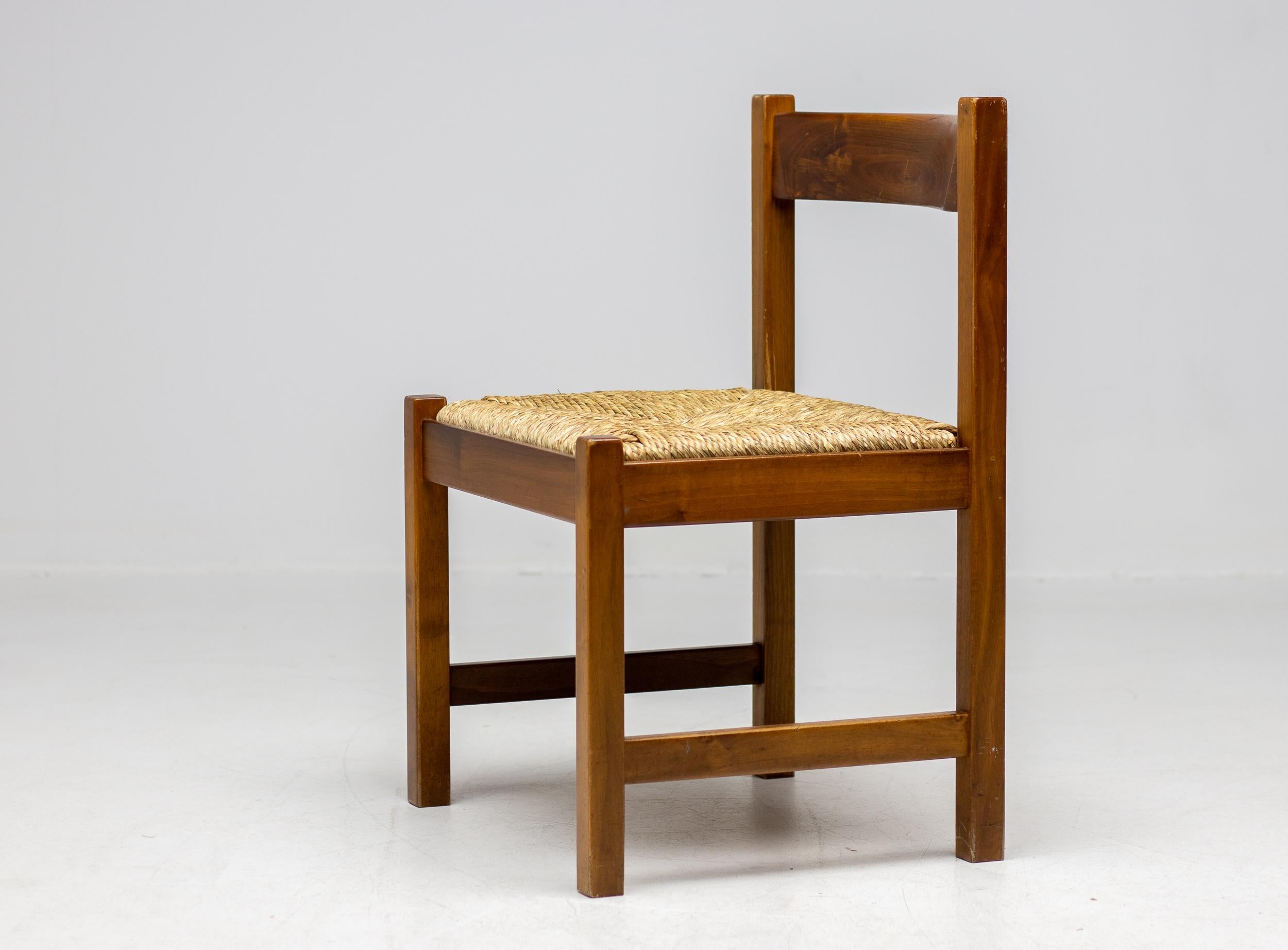 Set of 4 dining chairs from the Torbecchia series, designed by brutalist architect Giovanni Michelucci for Poltronova, 1964. 
Solid walnut structure with seats upholstered in cane. 
This architectural set will enlighten your interior through its