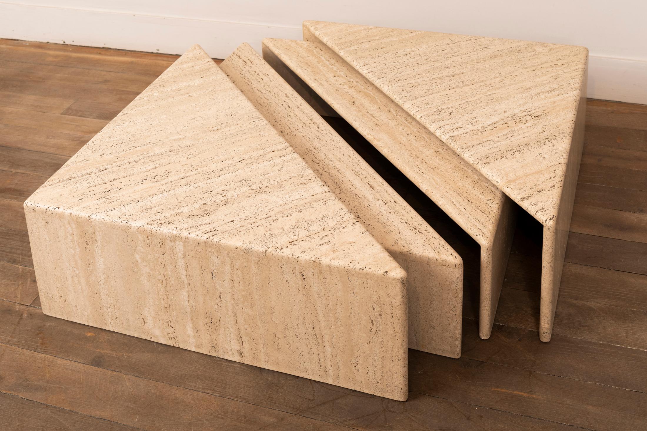 A set of 4 triangular elements forming two squares.
Travertine
It's possible to combine these elements in many ways to form one or more coffee tables.
Italy, 1970s.

Measures: 
Square 1 : 28 x 70 x 70 cm // 11 x 27.5 x 27.5 in.
Square 2 : 23