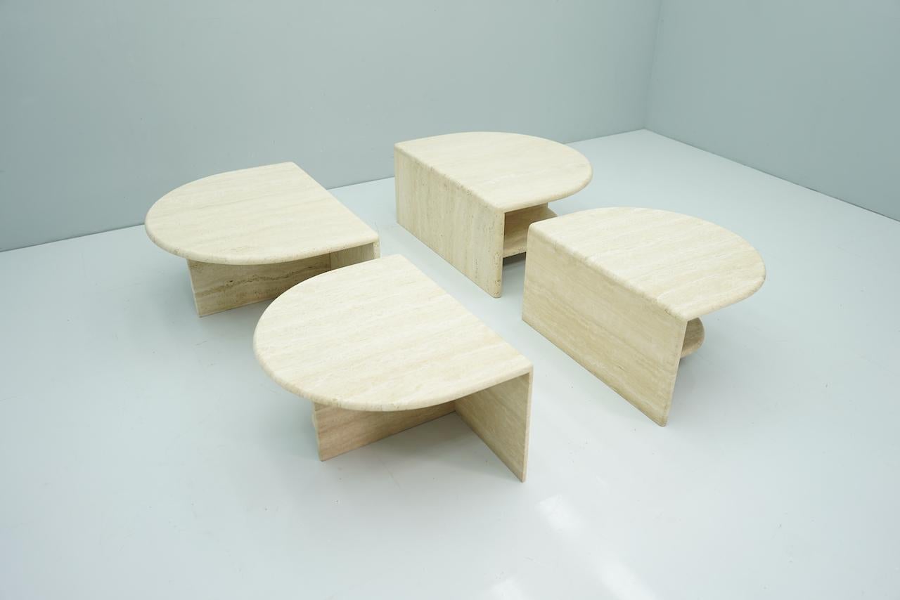 Set of four travertine side or coffee tables, Italy, 1970s.
 

Measurements per item:
2 x W 60 cm (23.6 in), D 75 cm (29.5 in), H 40.5 cm (15.9 in)
2 x W 75 cm (229.52 in), D 90 cm (35.4 in), H 40.5 cm (15.9 in)

Very good condition.
 