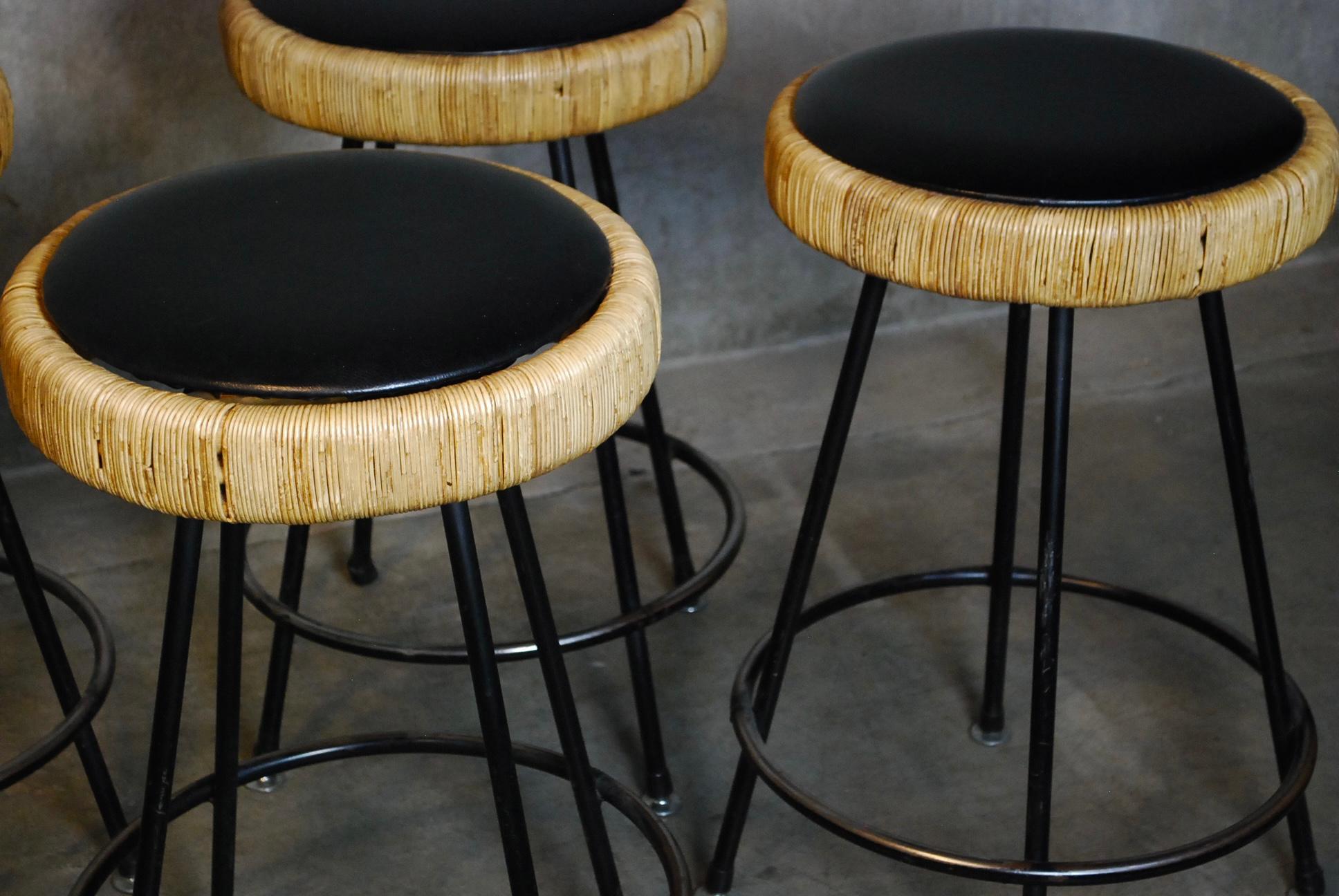 Set of four authentic stools showing use and wear hopwerver remain solid with minor usage in rattan. Tags are under seat.

Founded over a half century ago, Fong Brothers Company is a third generation family-run business focused on hand-made