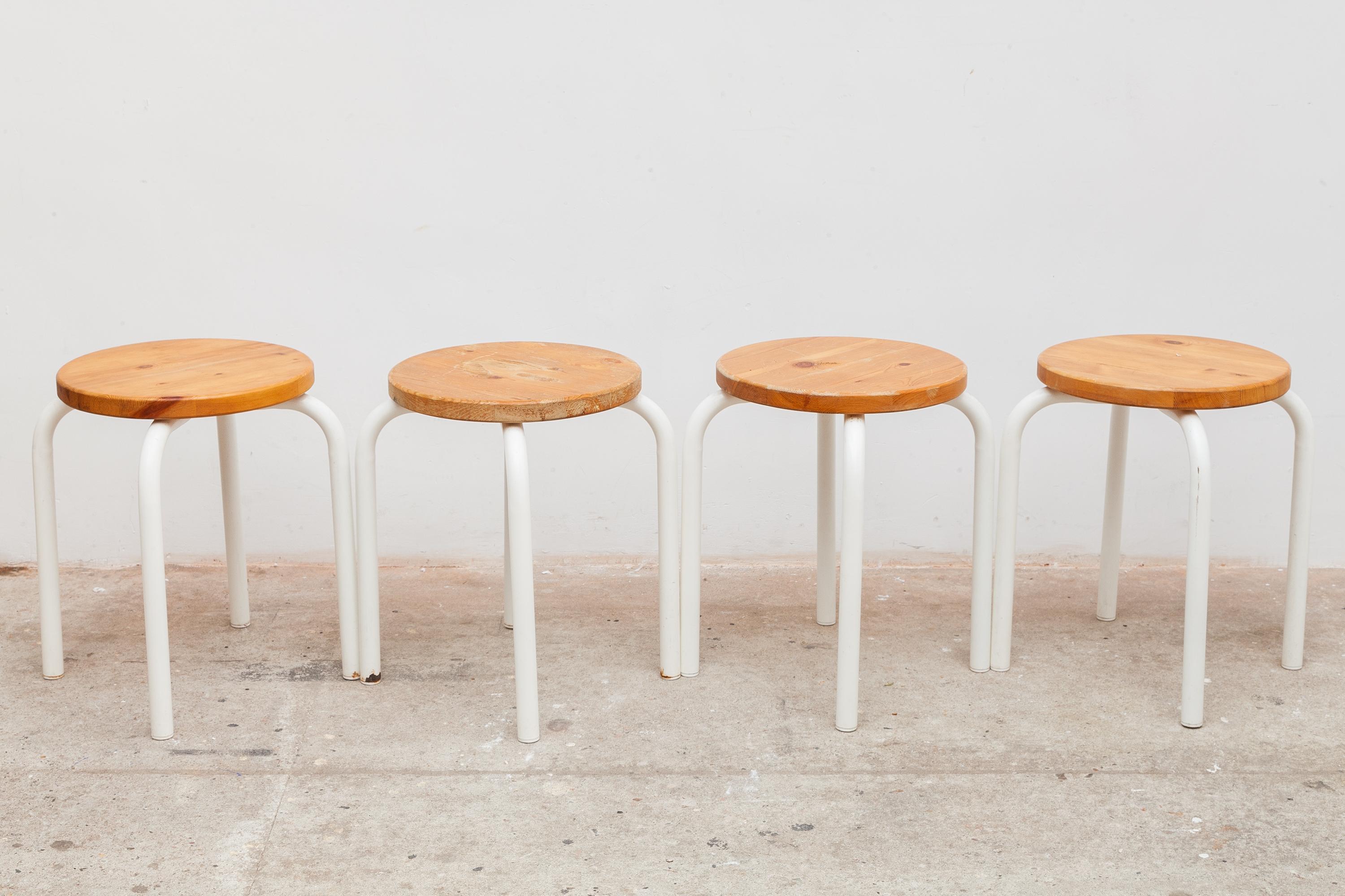 Set of four vintage stacking stools. Tubular metal frames in white enamel and pine wooden tops 43W x 46H, Seat: 46 cm high. Dimensions: 43W x 45H cm.