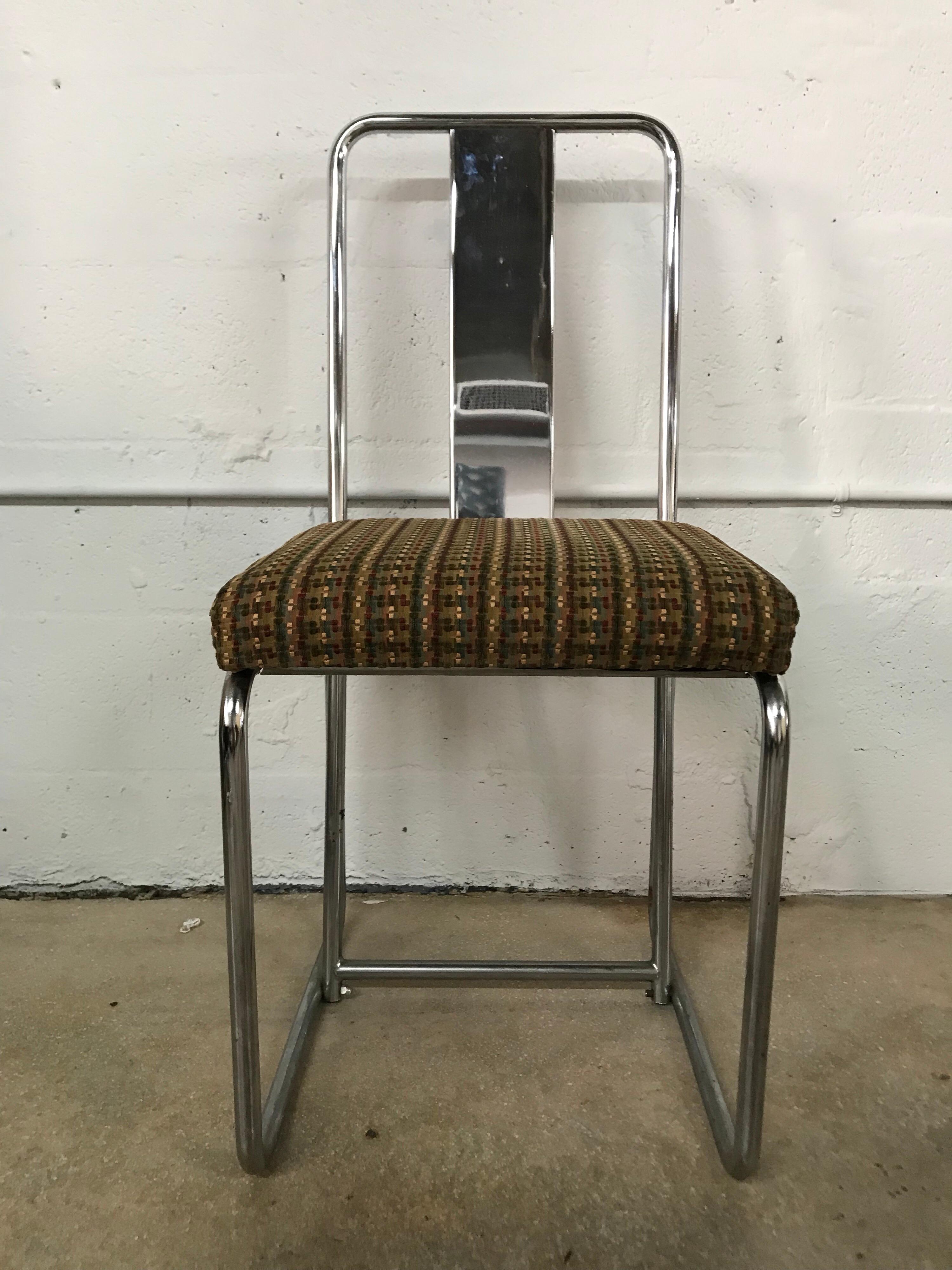 Set of dining chairs rendered in tubular chrome original multi-color woven upholstery, 1980s
