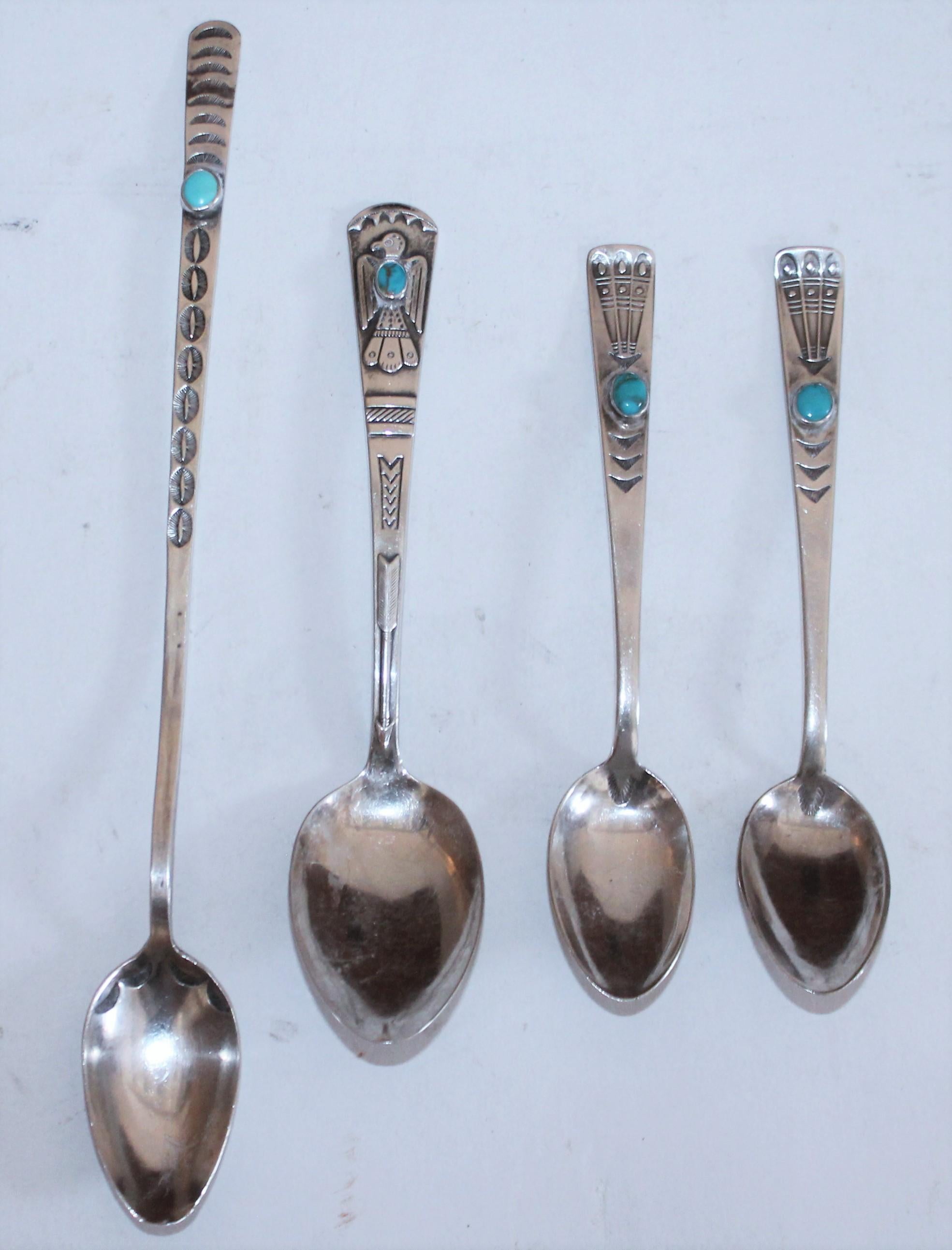 Set of four native American silver with turquoise spoons.
Measures: Large spoon 8