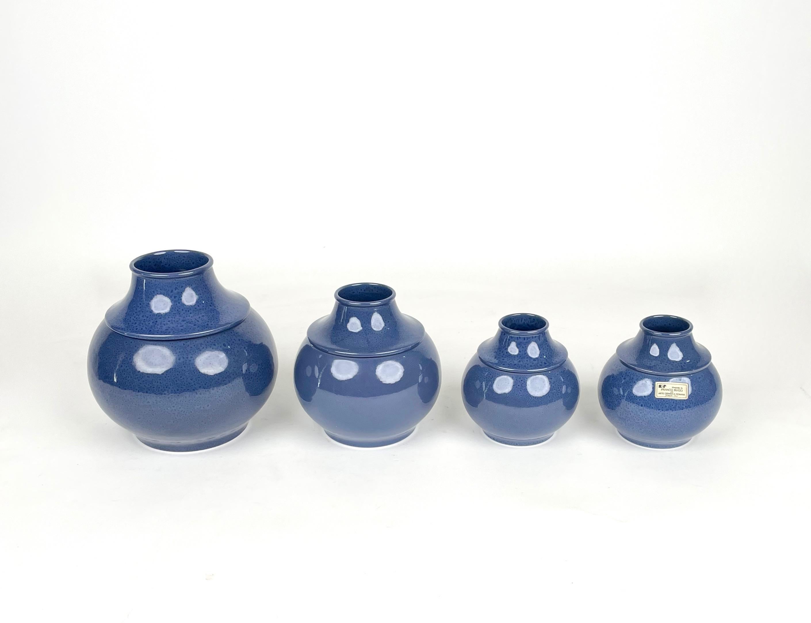 Set of four ceramic vases in decrescent sizes by Franco Bucci for Arte Ceramica Romana made in Italy in the 1970s. 

Dimensions:
Vase 1: 22cm height 22cm diameter 
Vade 2: 19cm height 18cm diameter
Vase 3: 15cm height 13cm diameter 
Vase 4: