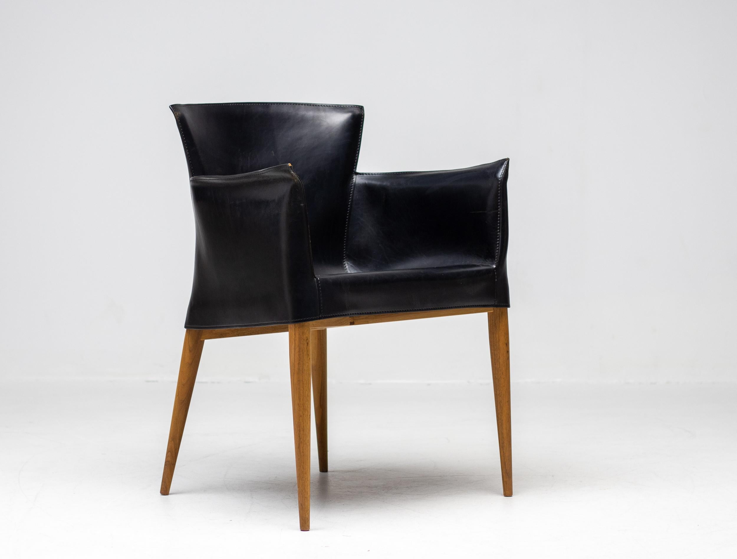 Rare Carlo Bartoli for Matteo Grassi Vela armchairs in black Italian leather, made in Italy, circa 1980.
High-end chair consisting of handstitched leather upholstery wrapped over an internal walnut frame. 
The design of this chair is inspired by how