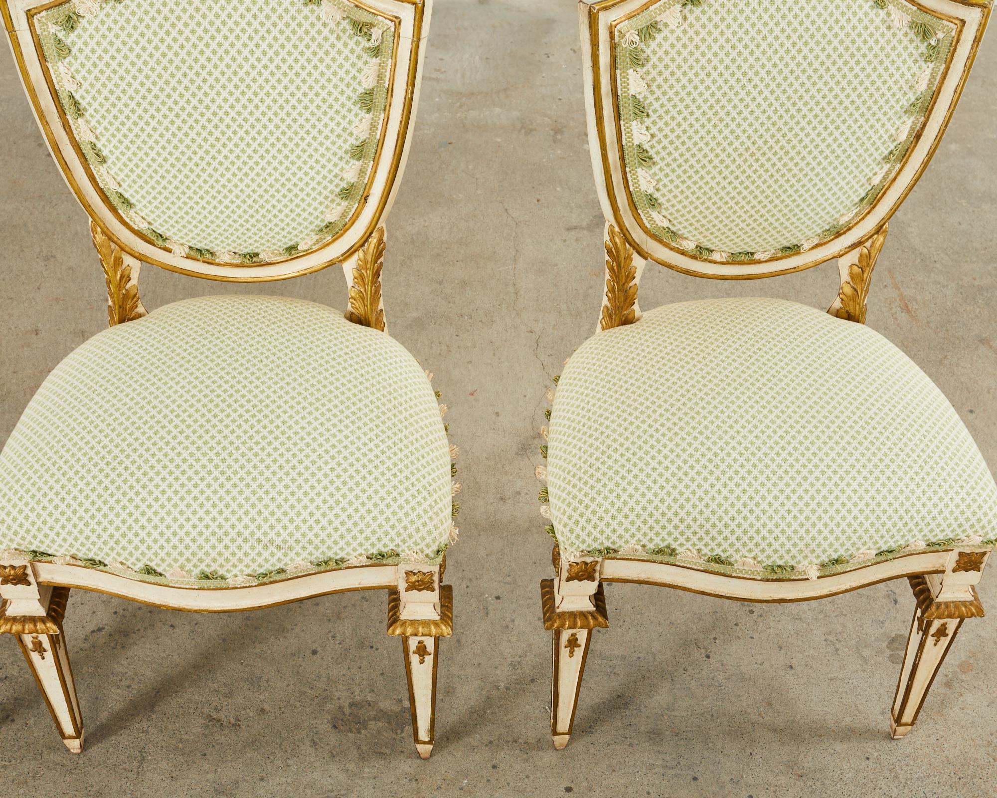 Fabric Set of Four Venetian Parcel Gilt Painted Shield Back Dining Chairs For Sale