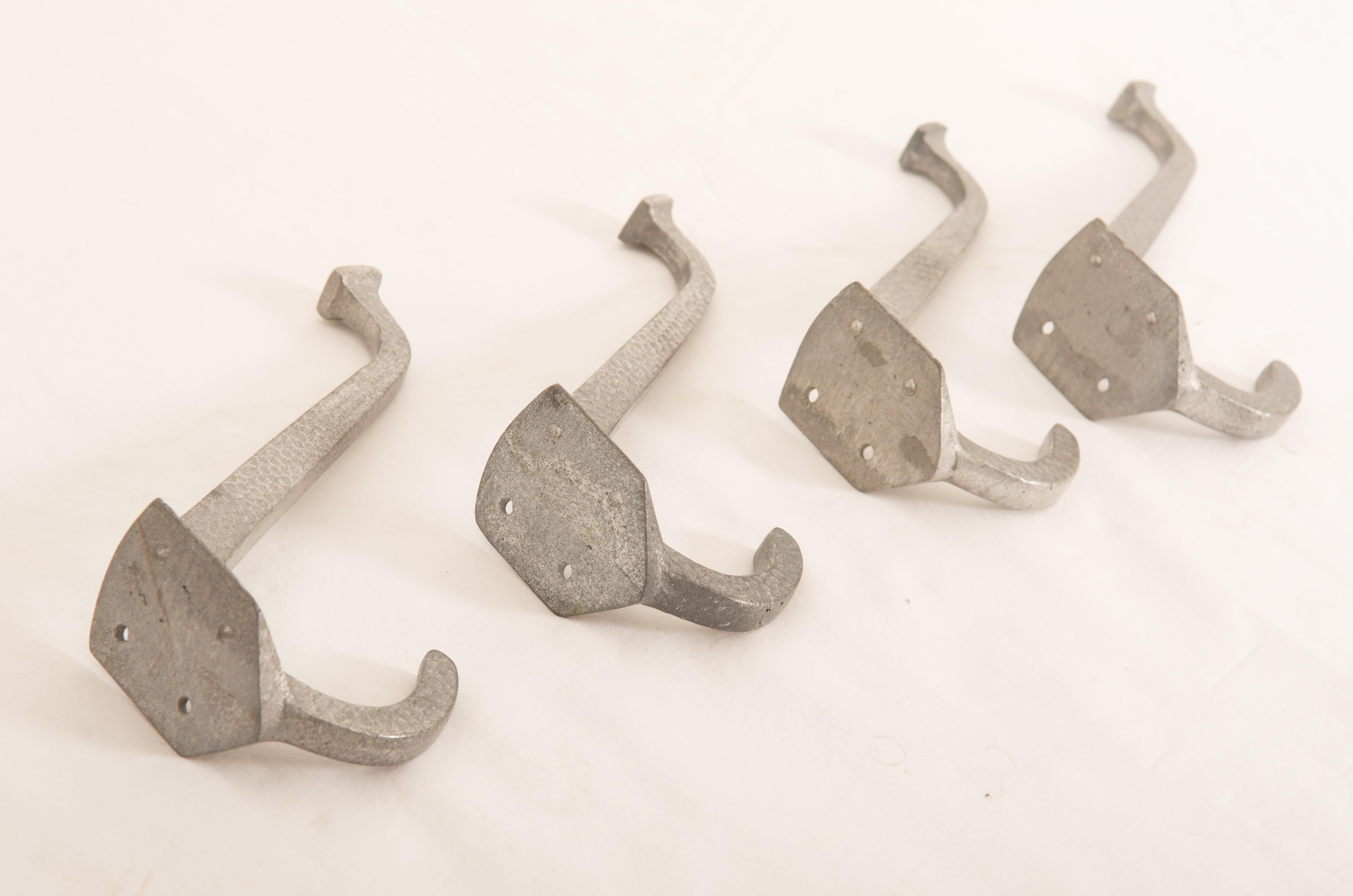Set of four aluminum coat hooks made in Austria about 1910. 
