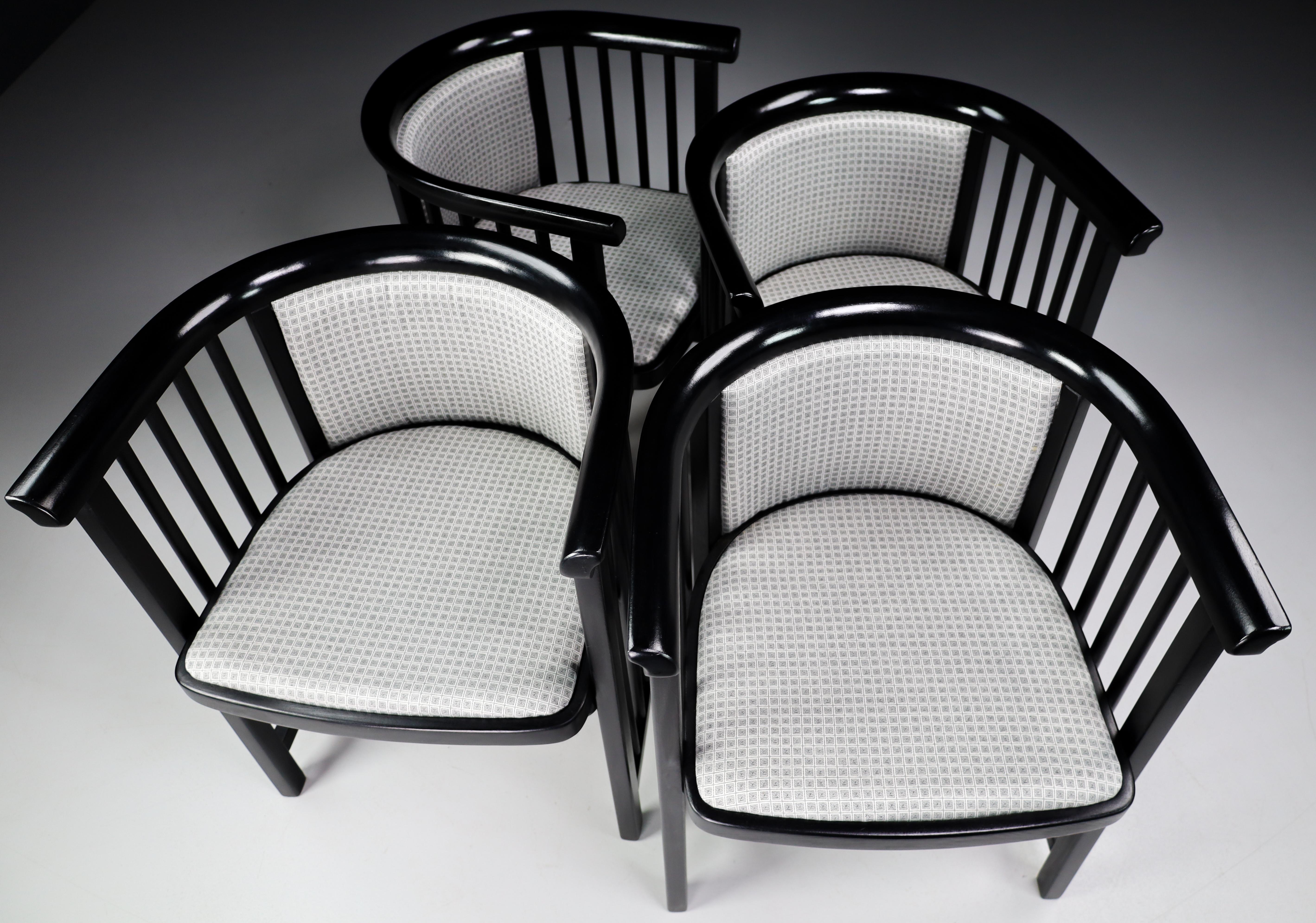 Set of Four restored Vienna Secession armchairs in black bentwood with grey fabric upholstery designed by Josef Hoffmann, Austria 1930s . These armchairs would make an eye-catching addition to any interior such as living room, family room, screening