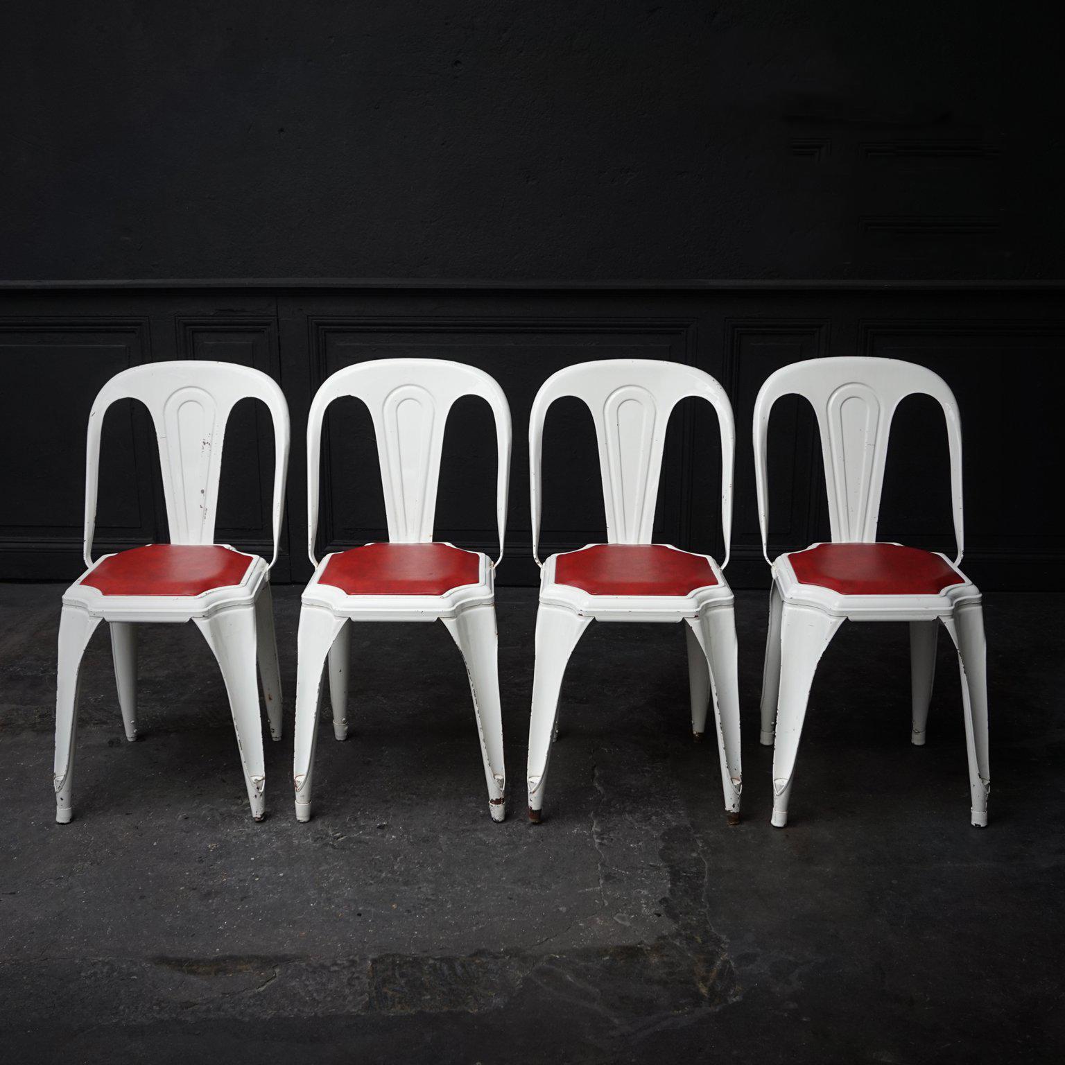 Rare 1950s Fibrocit Industrial steel structure chairs. One of the first stackable and stainless terrace chairs, also known as the Belgian Tolix.

Look how pretty this white-red Industrial stackable set of four metal bistro chairs is. They are in