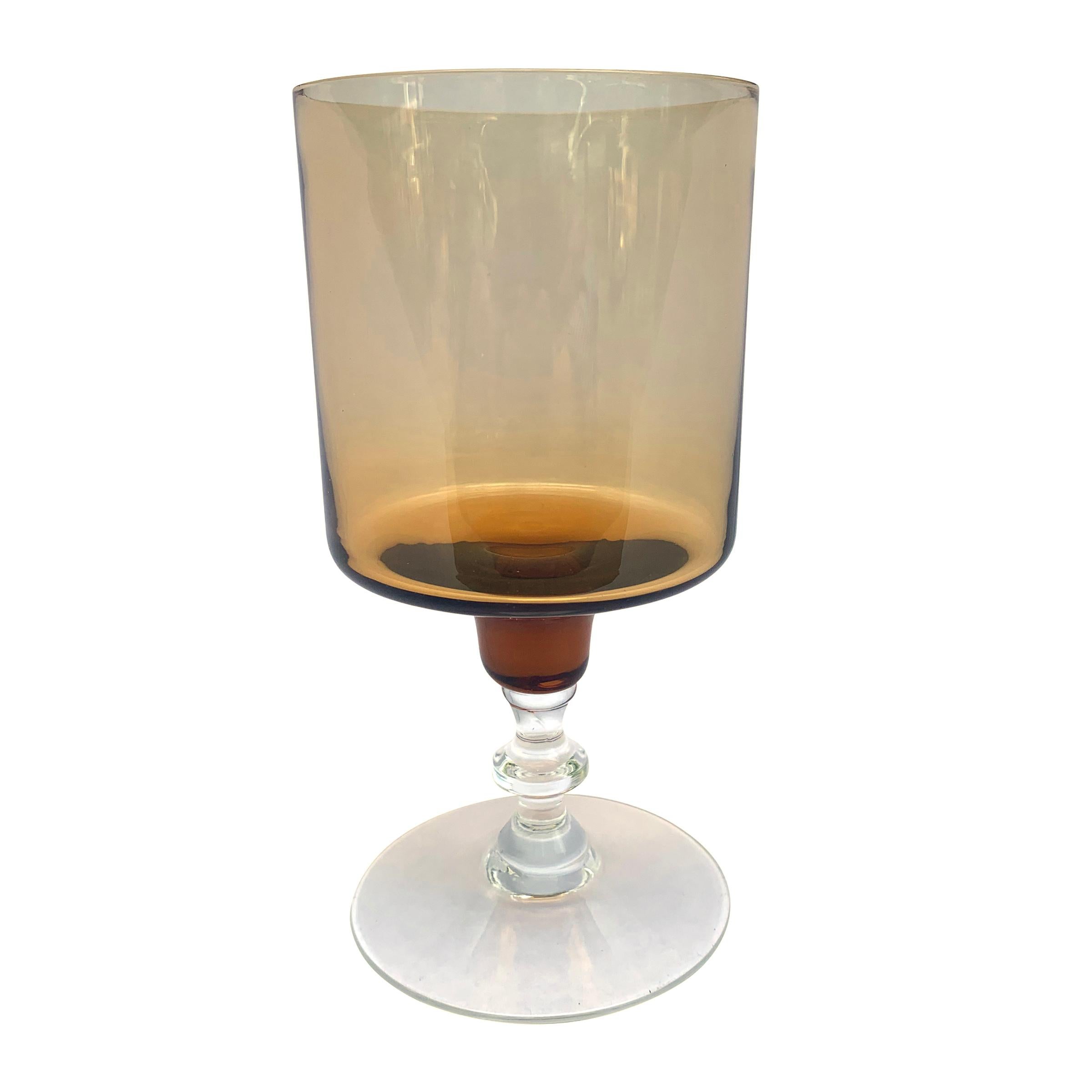 A chic set of four blown amber wine glasses with square-form goblets and clear knobbed stems and feet. The perfect set for your next lunch party.
