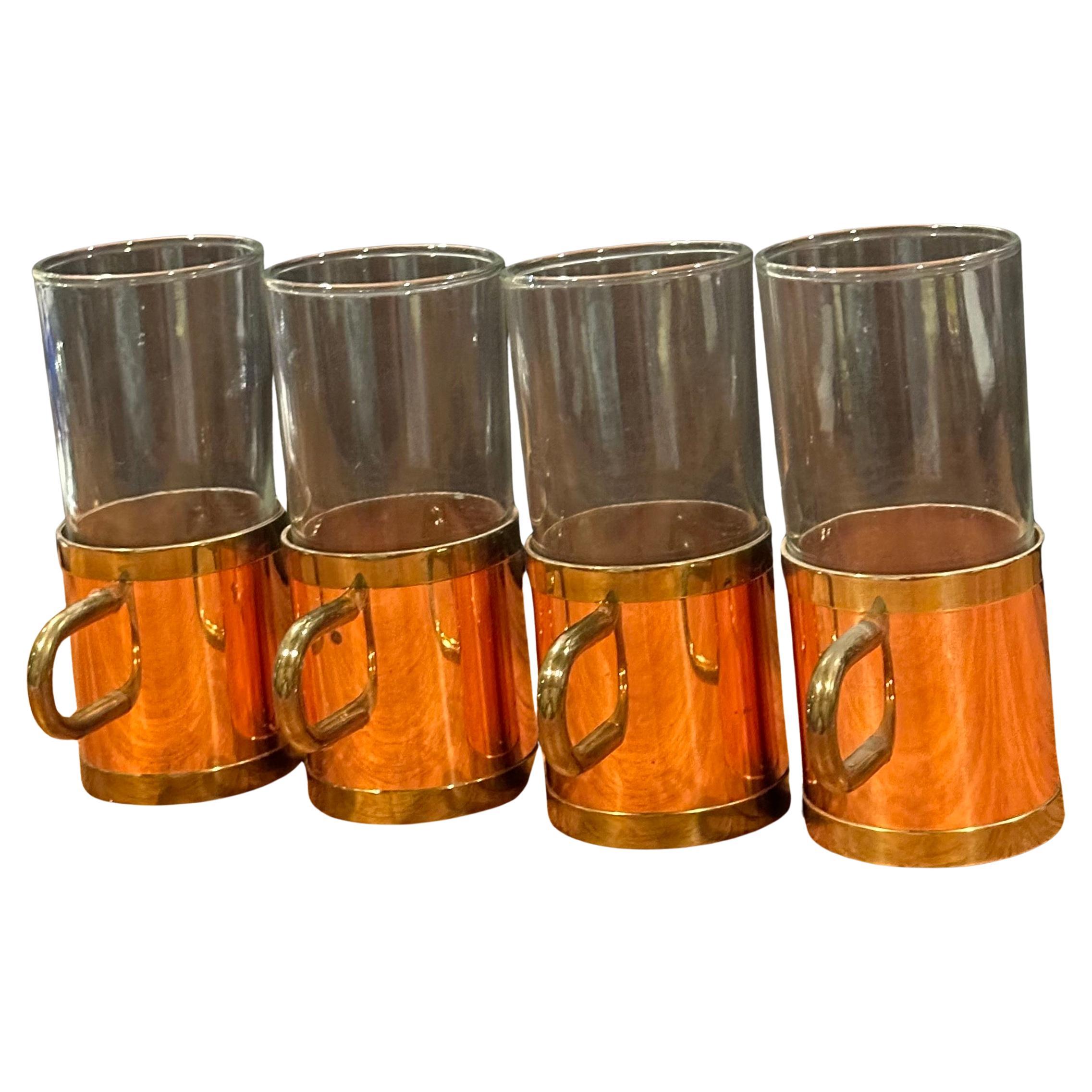 Vintage set of four beucler copper, brass and glass Irish coffee mugs, circa 1980s. The mugs are in good vintage condition with no chips or cracks and measure 3.5