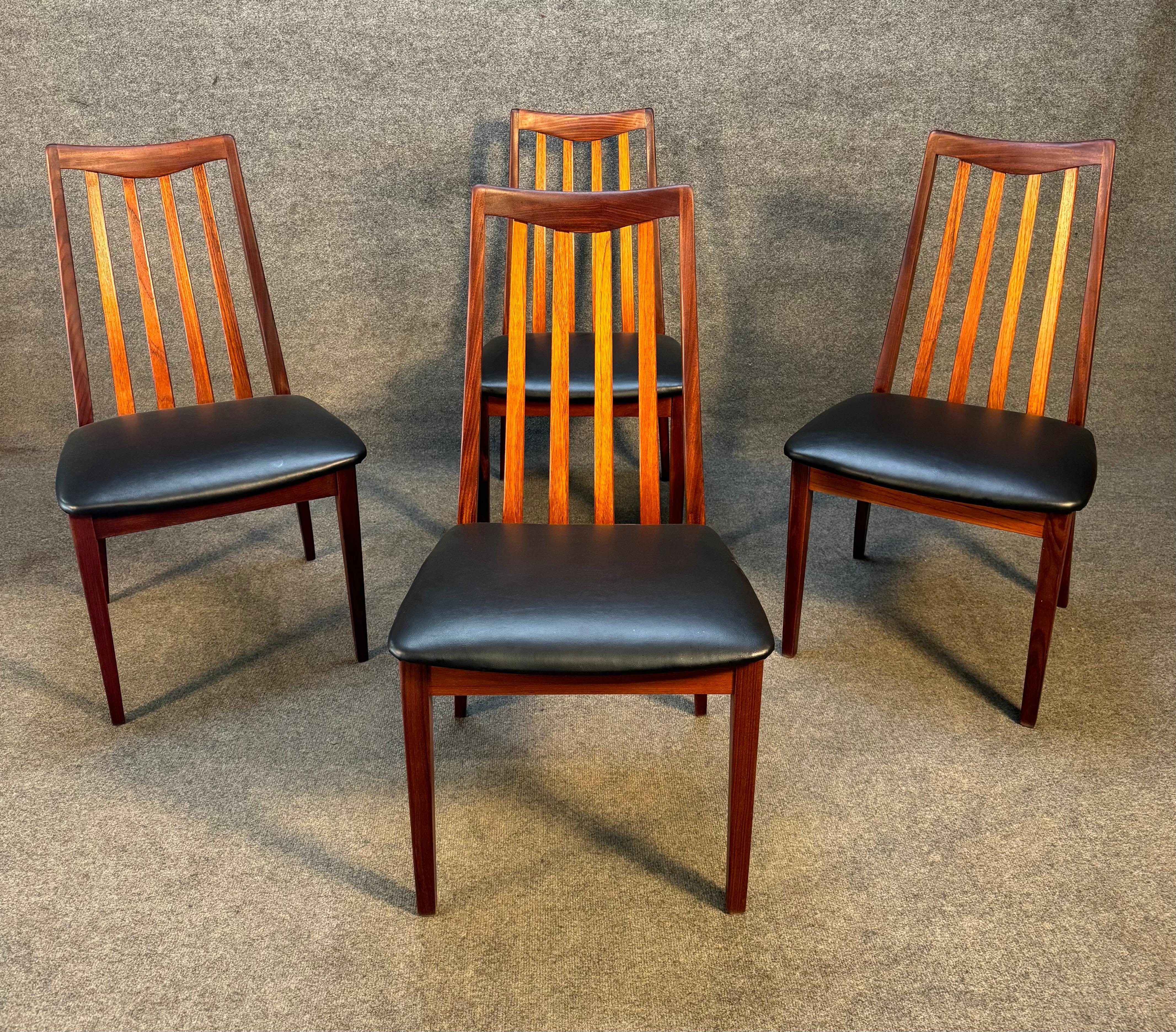 Here is a set of four beautiful British MCM teak dining chairs manufactured by G Plan in the 1960's. These comfortable high back chairs, recently imported from England to California before their refinishing, feature a vibrant wood grain, an