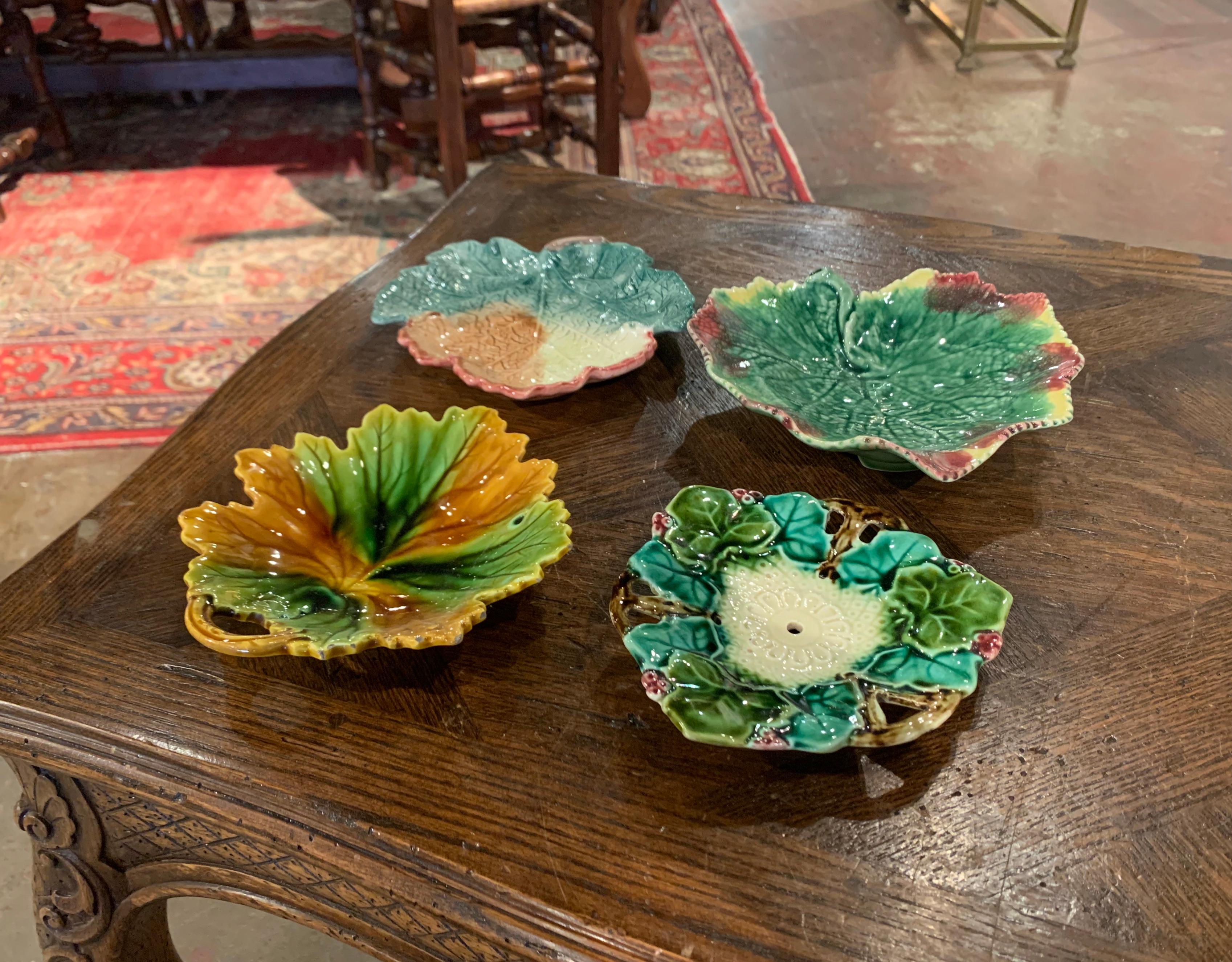 Catch loose change and nick knacks with this four majolica dishes; shaped as leaves, the ceramic bowls are hand painted in the green palette. The decorative vide poches are in excellent condition with rich colors.
Measures: Largest: 7