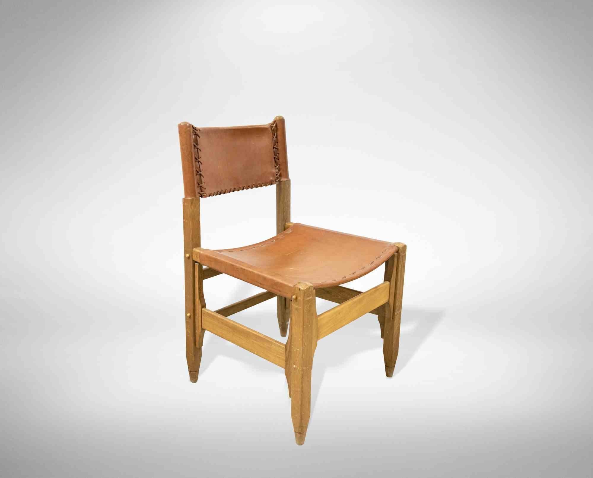 Set of four vintage chairs is an original design furniture item realized by Werner Biermann for Arte Sano, Colombia, in 1960s.

Teak and walnut, leather.

Iconic and rare set of four chairs, in excellent condition.