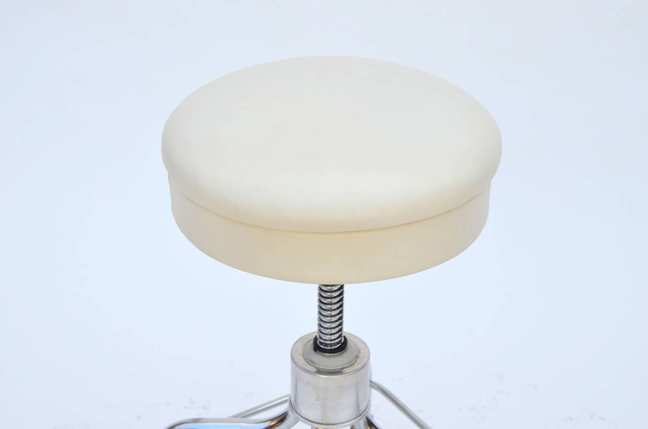 white rolling stool
