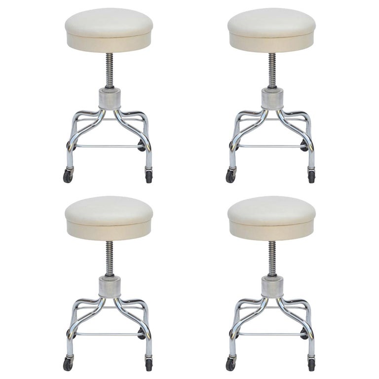 Set of Four Vintage Chrome and White Leather Adjustable Rolling
