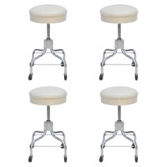 Set of Four Vintage Chrome and White Leather Adjustable Rolling Stools