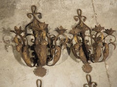 Set of Four Vintage French 3-Arm Iron and Tole Sconces, Distressed Gilt Finish
