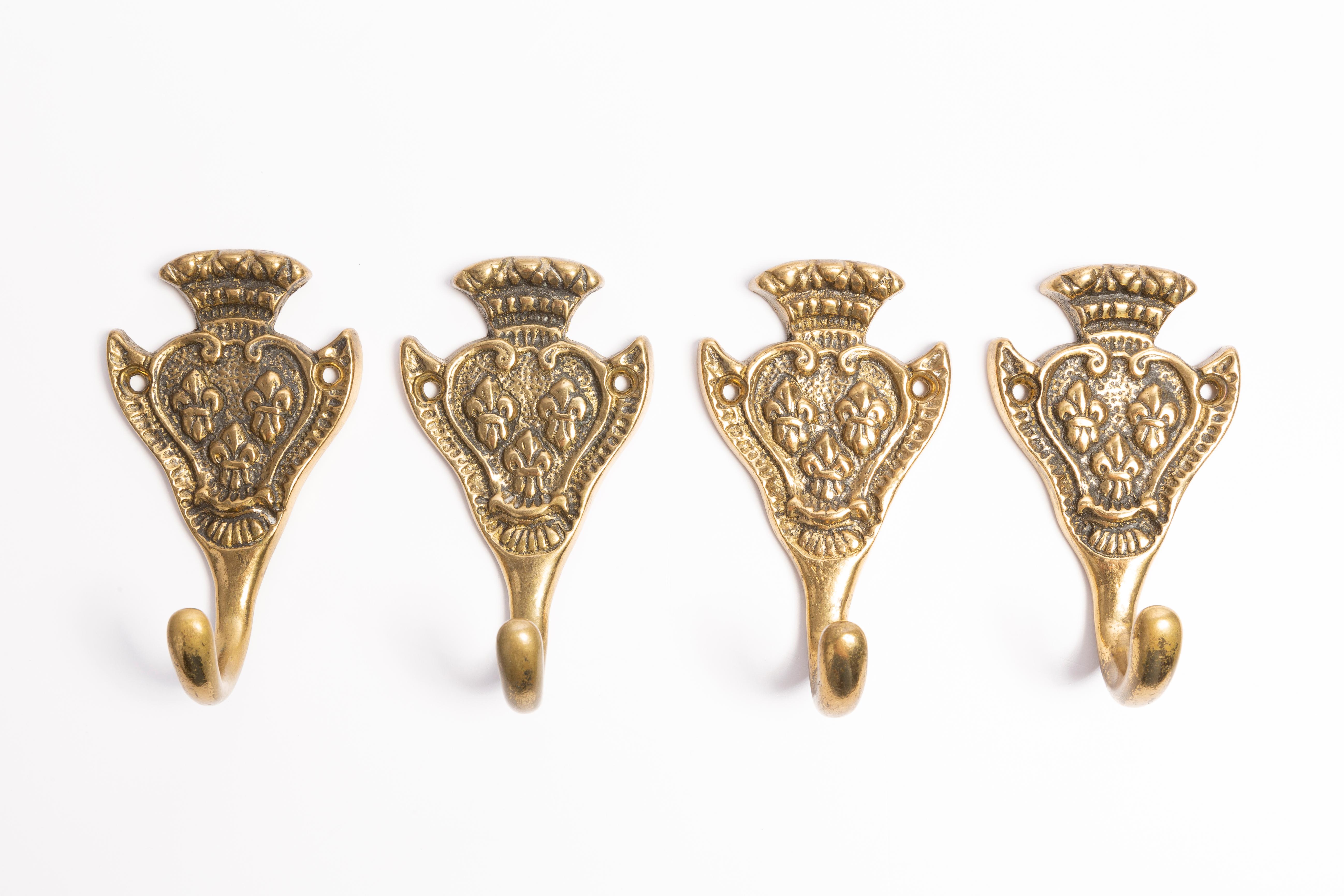 Set of four beautiful vintage wall decorative hangers, gold painted. Made in Italy in 1960s. Only one unique set.