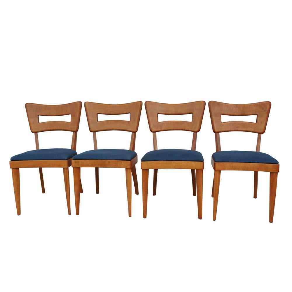 Heywood-Wakefield


A set of four vintage Heywood Wakefield Dogbone side chairs with a blue fabric seat. The dogbone chair is one of Heywood Wakefield's most iconic designs and has come to represent the distinctly American woodworking of the