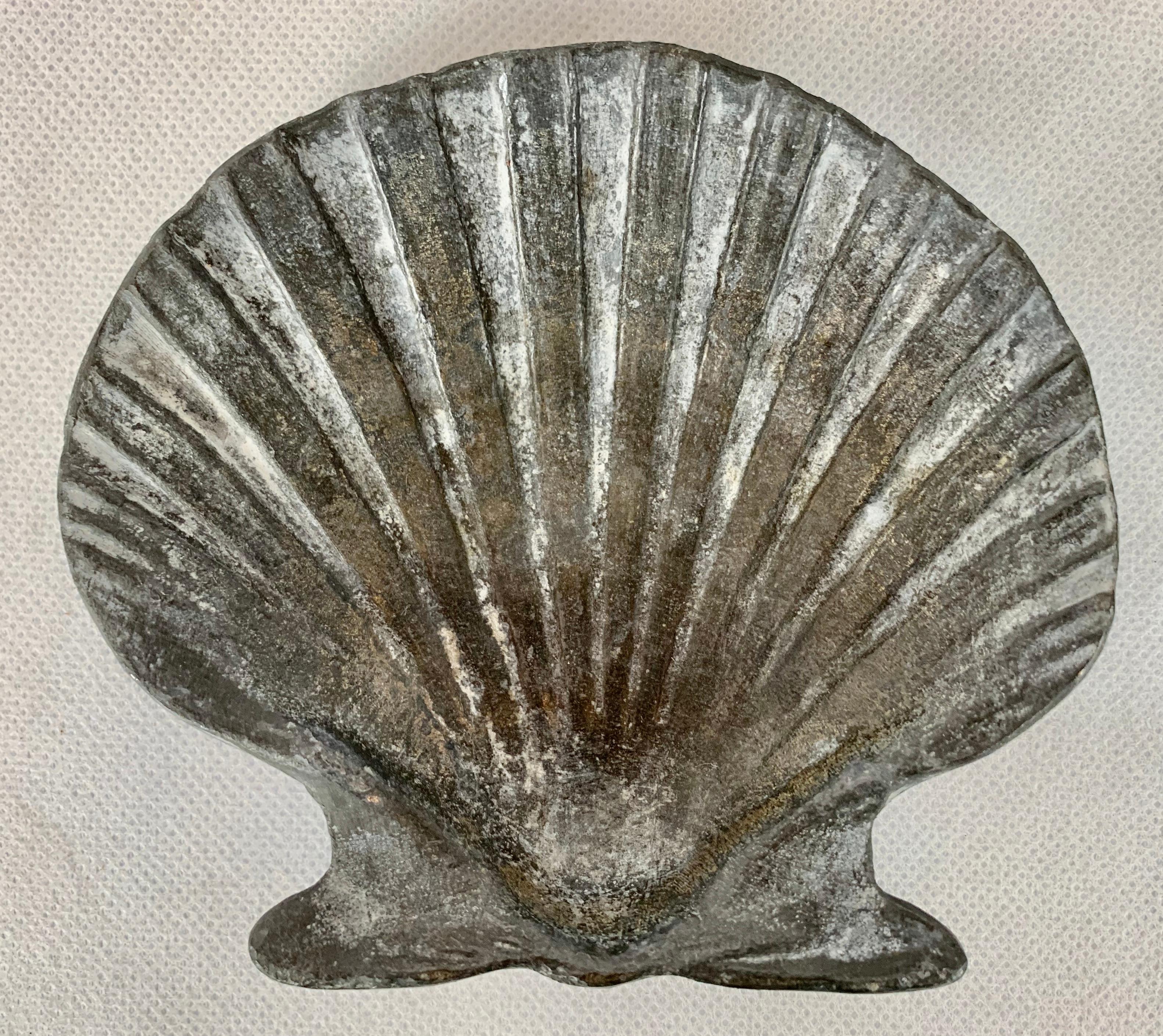 Garden items made from lead were ideal as they do well in most climates and achieve a favorable patina. This set of four are scallop shells and well modeled. I imagine they could be built into a wall, corners of a floor or used strictly for