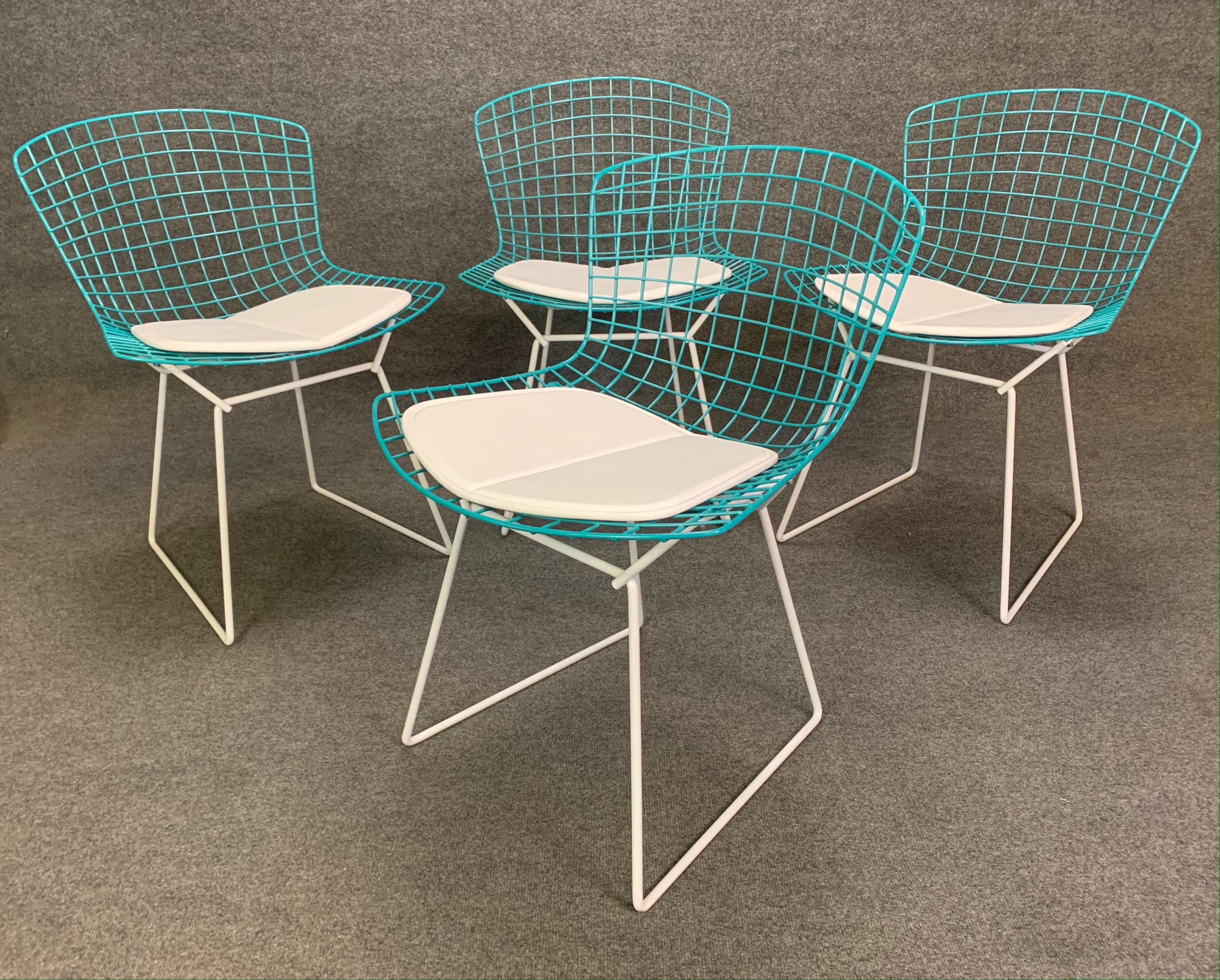 Here is a beautiful set of four vintage MCM chairs designed by Harry Bertoia and manufactured in the USA by Knoll in the 1960s. This set has been fully restored; each frame has been sandblasted and powder coated in white and teal colors. Hardware is