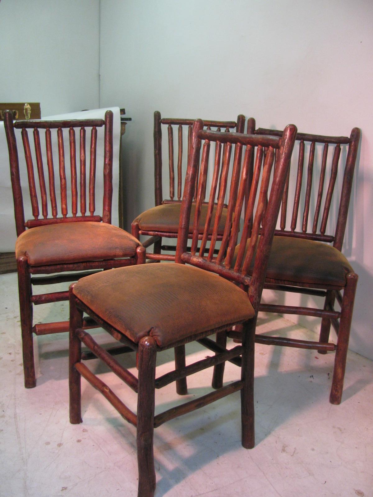Fabulous set of four Old Hickory side chairs reupholstered in faux alligator leather. Chairs are circa 1935, and in excellent condition with normal wear.
