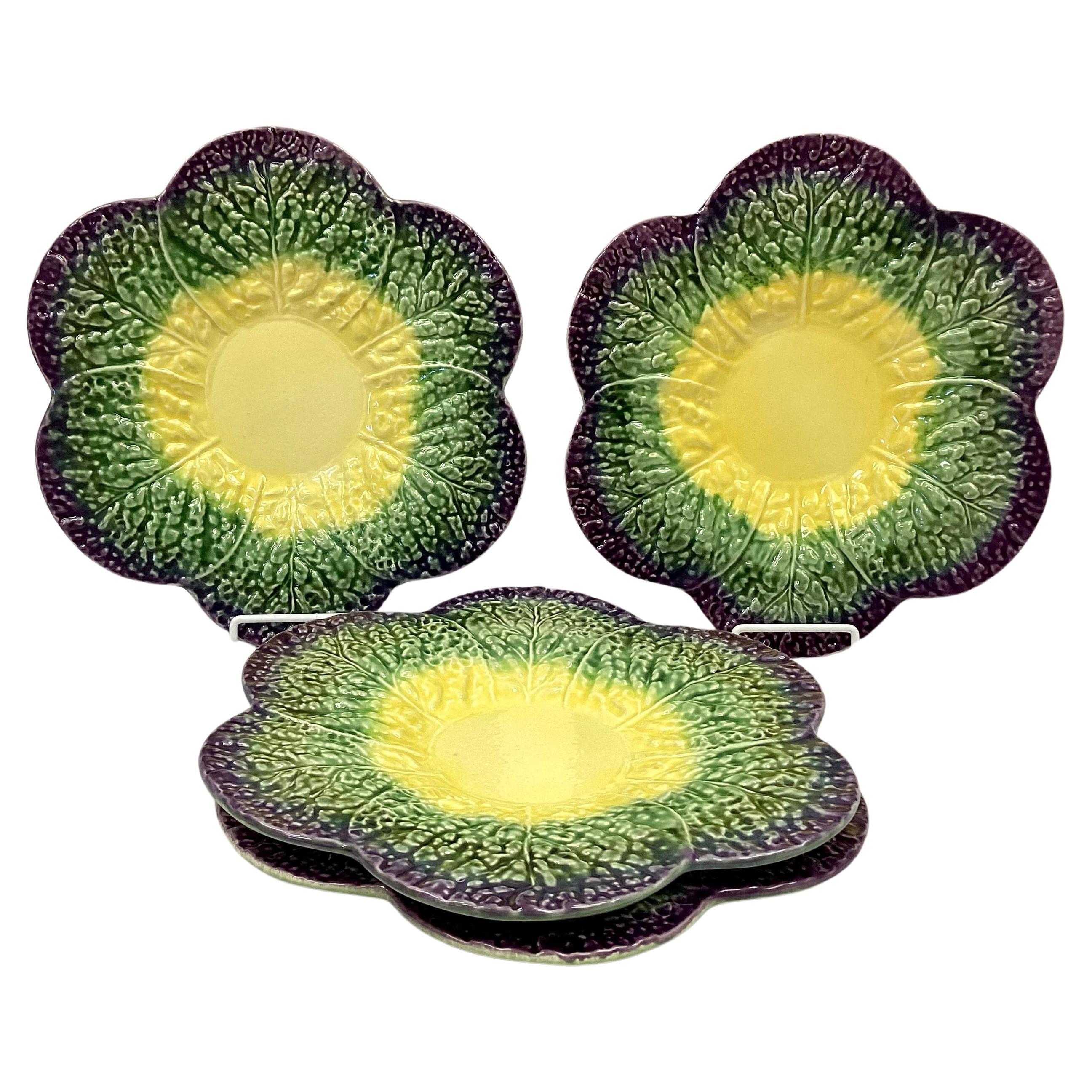 Unique vintage set of four Olfaire Portugal ceramic charger plates. Bright colors of yellow(center) with green and purple scalloped edges. Excellent condition. Manufacturer mark and number on reverse side.