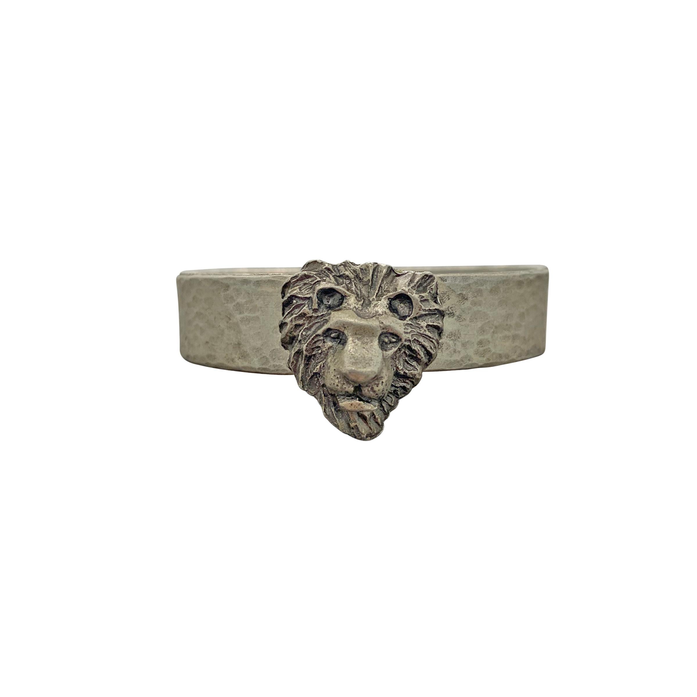 A whimsical set of four vintage German pewter safari themed napkin rings each depicting a different African animal, a lion, a tiger, an elephant, and an antelope. Marked 