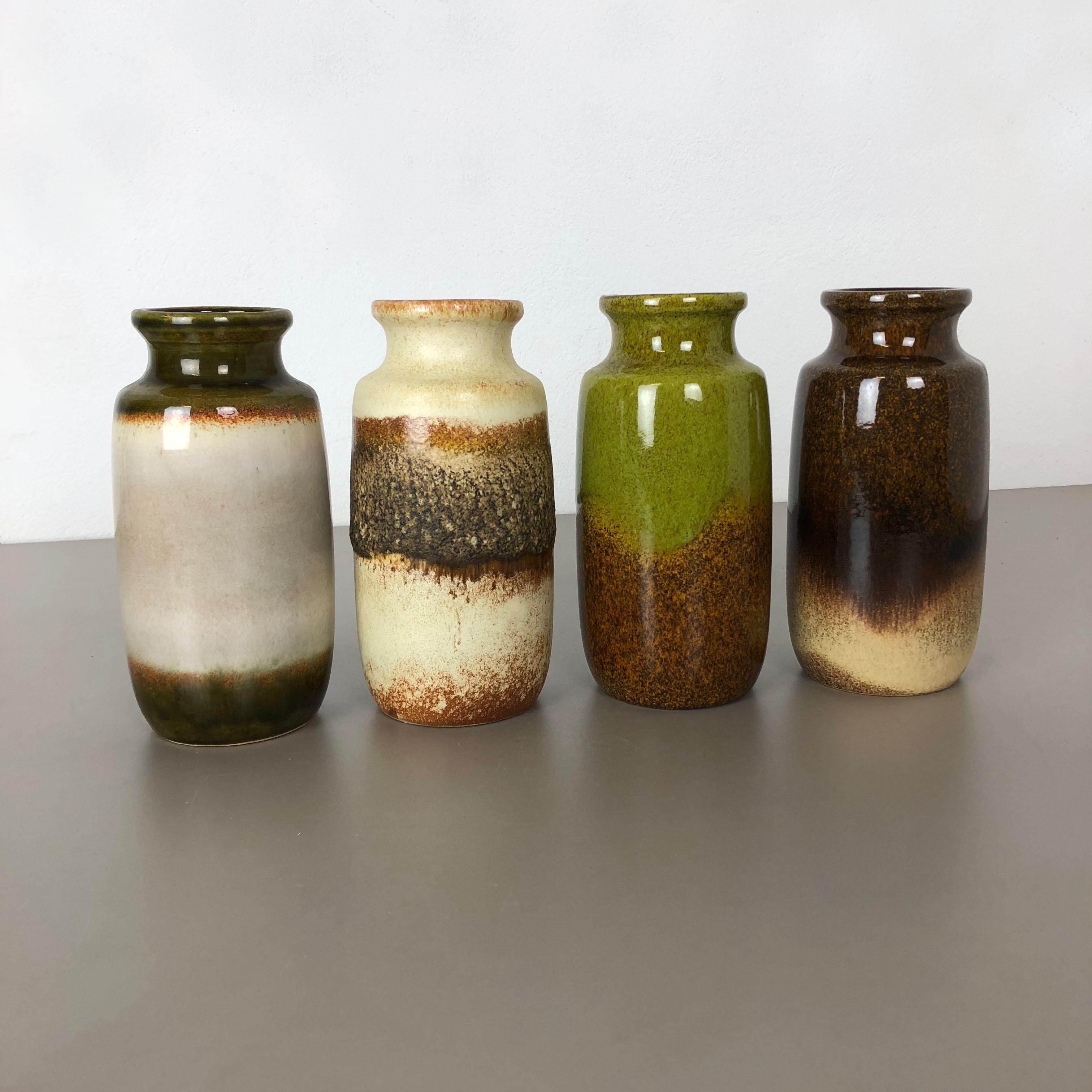 Article:

Set of four fat lava art vases

Producer:

Scheurich, Germany

Decade:

1970s

These original vintage vases was produced in the 1970s in Germany. It is made of ceramic pottery in fat lava optic. Super rare in this coloration.