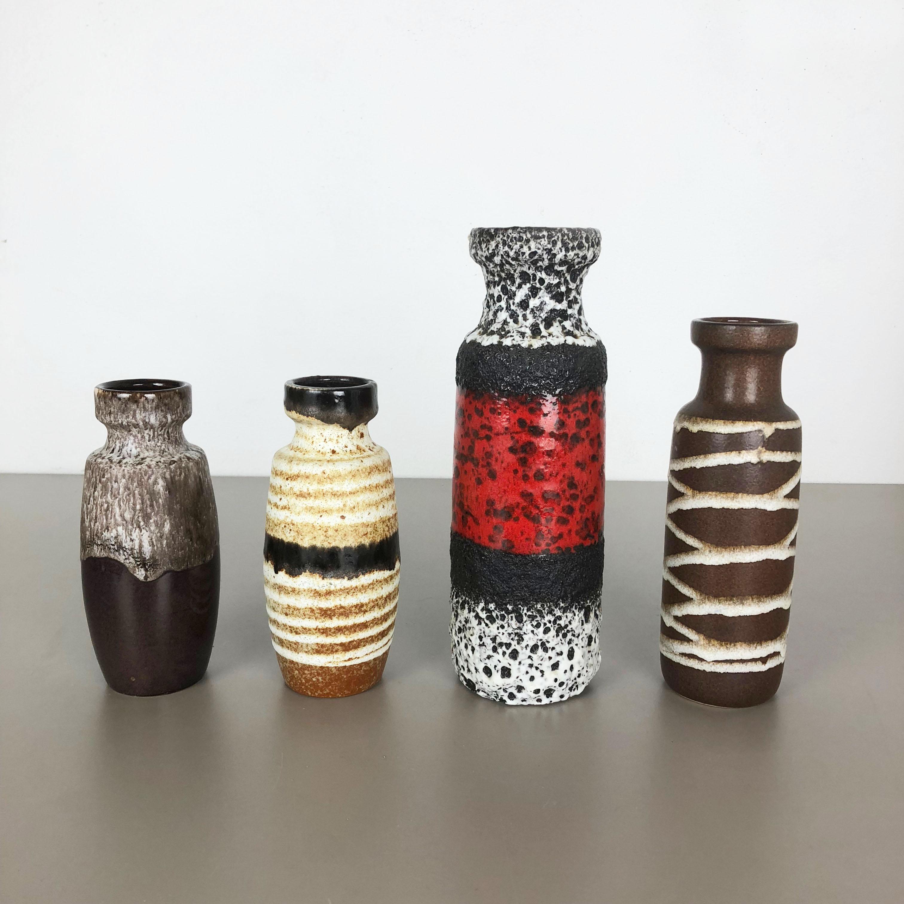 Article:

Set of four fat lava art vases

Producer:

Scheurich, Germany

Decade:

1970s

model:
210-18
200-22
200-28

These original vintage vases was produced in the 1970s in Germany. It is made of ceramic pottery in fat lava