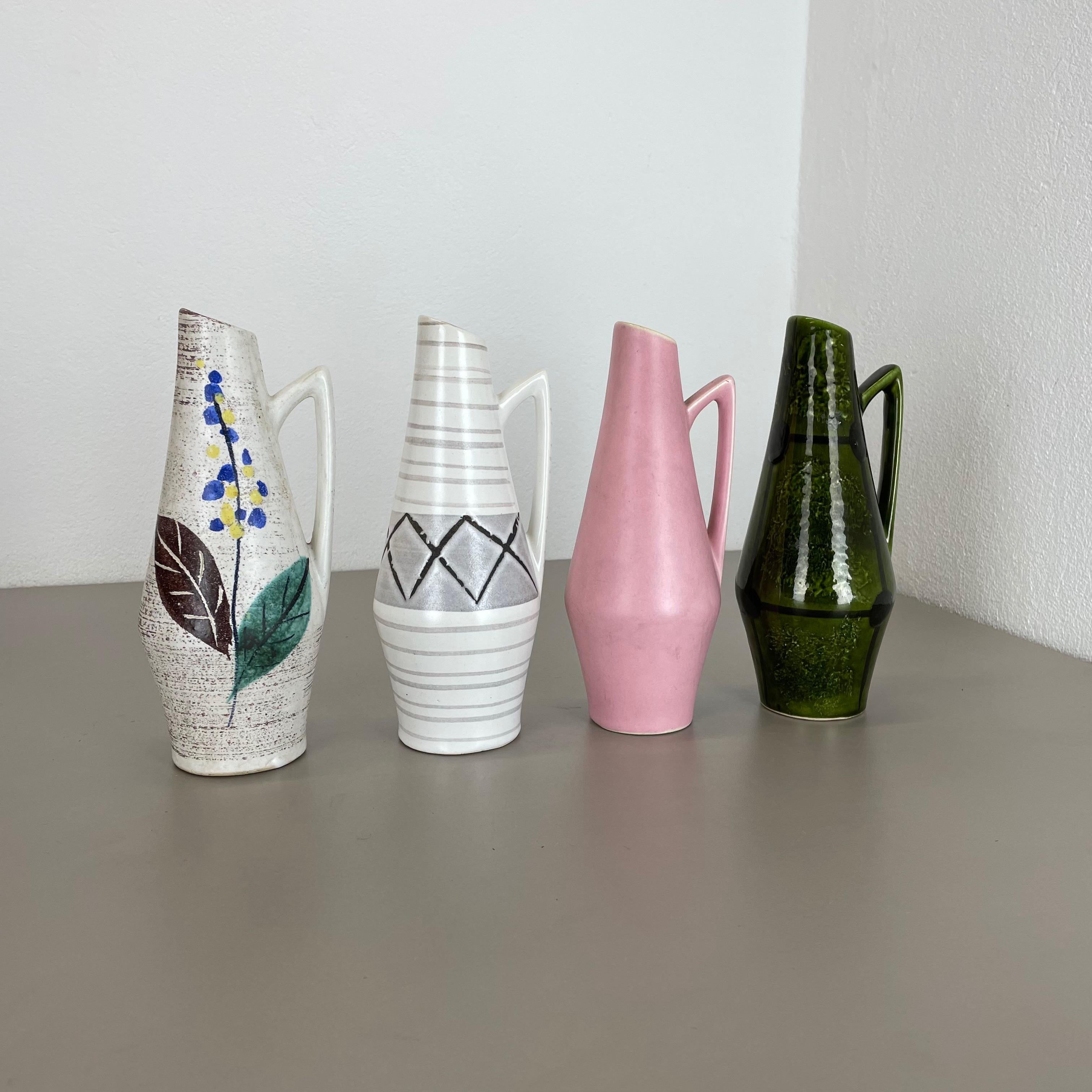 Article:

Set of four fat lava art vases


Producer:

Scheurich, Germany



Decade:

1950s


These original vintage vases was produced in the 1950s in Germany. It is made of ceramic pottery in fat lava optic. Super rare in this