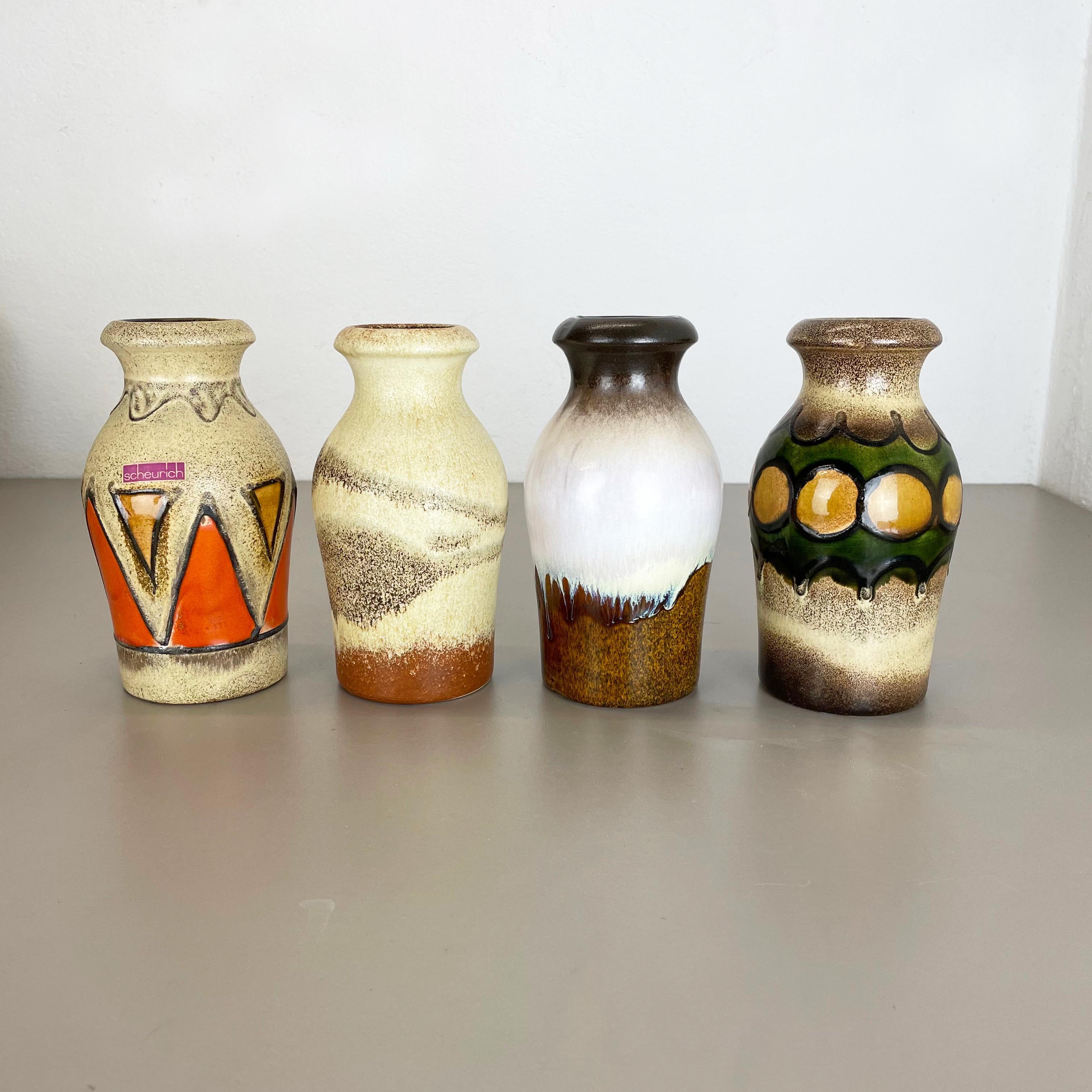Article:

Set of four fat lava art vases


Producer:

Scheurich, Germany


Design:



Decade:

1970s


This original vintage vase set was produced in the 1970s in Germany. It is made of ceramic in fat lava optic. Super rare in