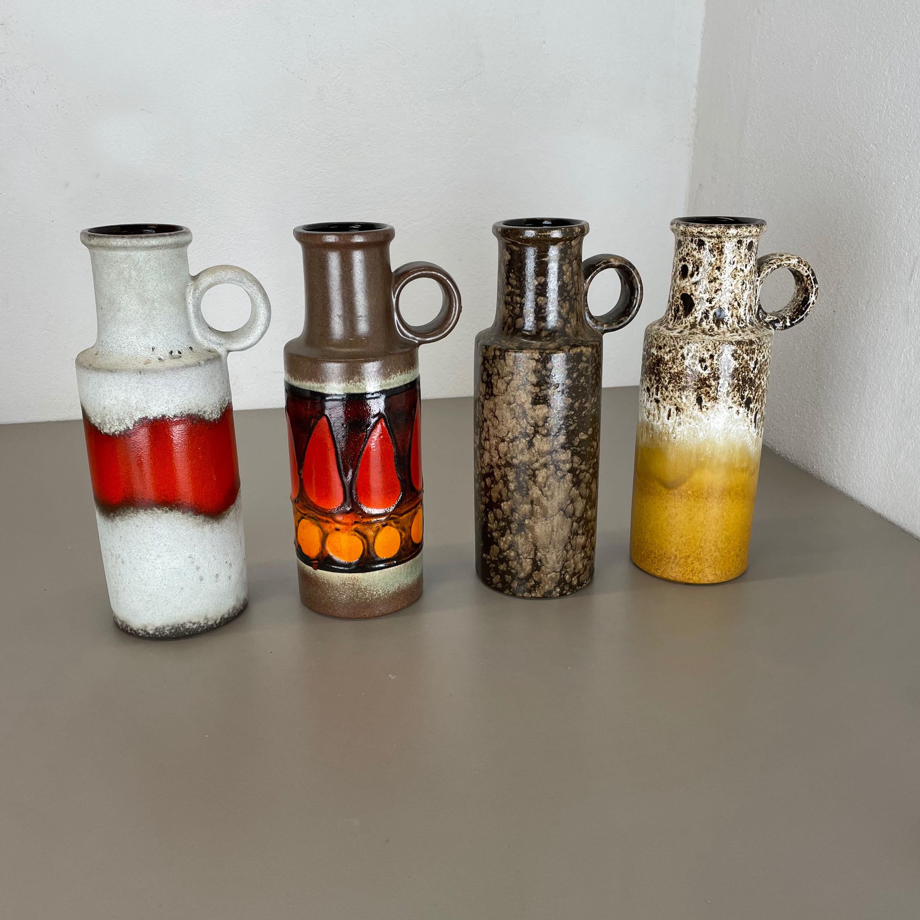 Article:

Set of four fat lava art vases


Producer:

Scheurich, Germany


Design:

Nr. 401-28



Decade:

1970s


This original vintage vase was produced in the 1970s in Germany. It is made of porcelain in Fat Lava Optic. Super