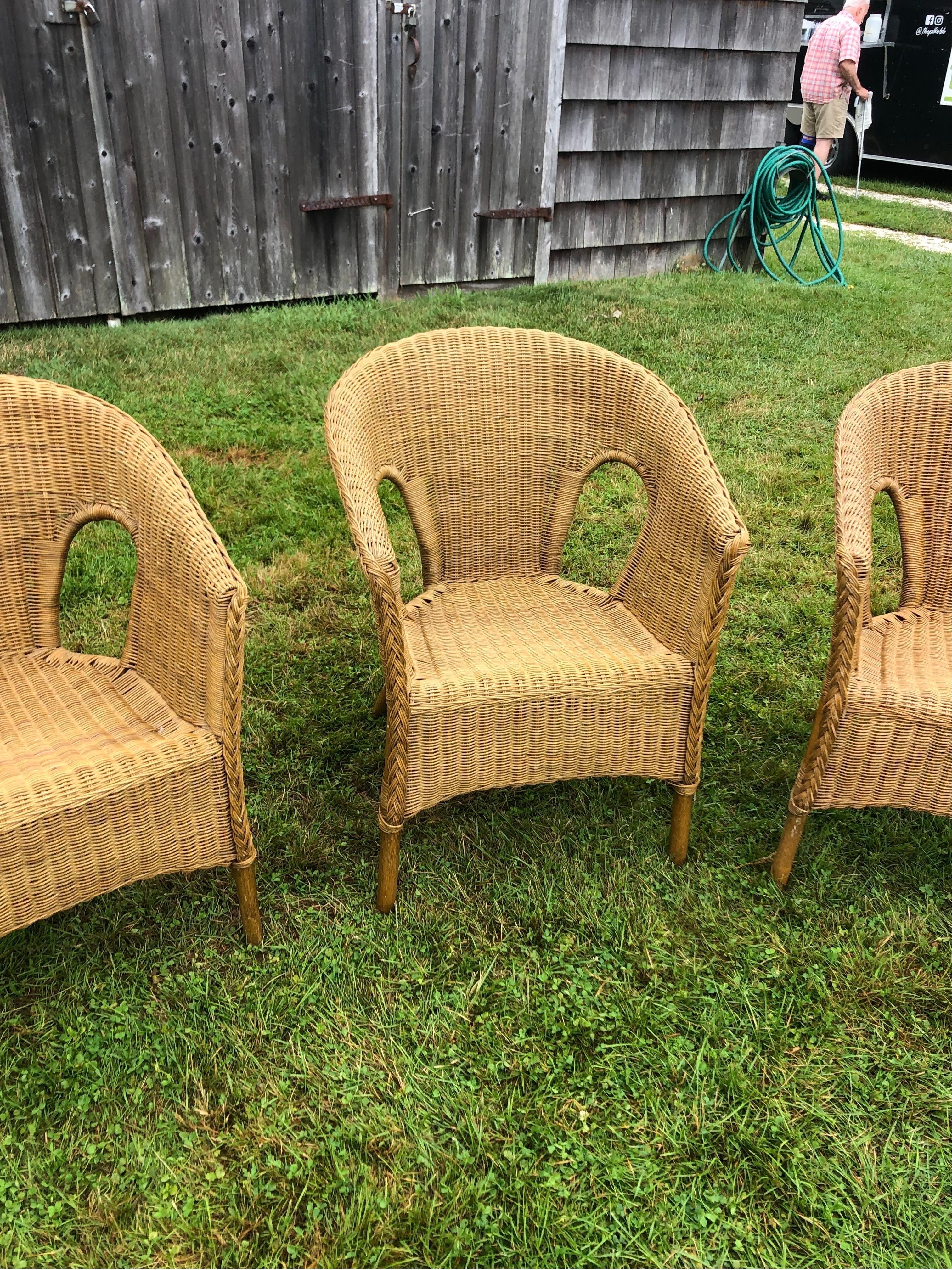 Set of Four Vintage Woven Wicker Chairs. A nice compact design making them  an ideal complement for any setting. Vintage wicker chairs can add charm and character to various interior or covered outdoor spaces. These chairs are quite