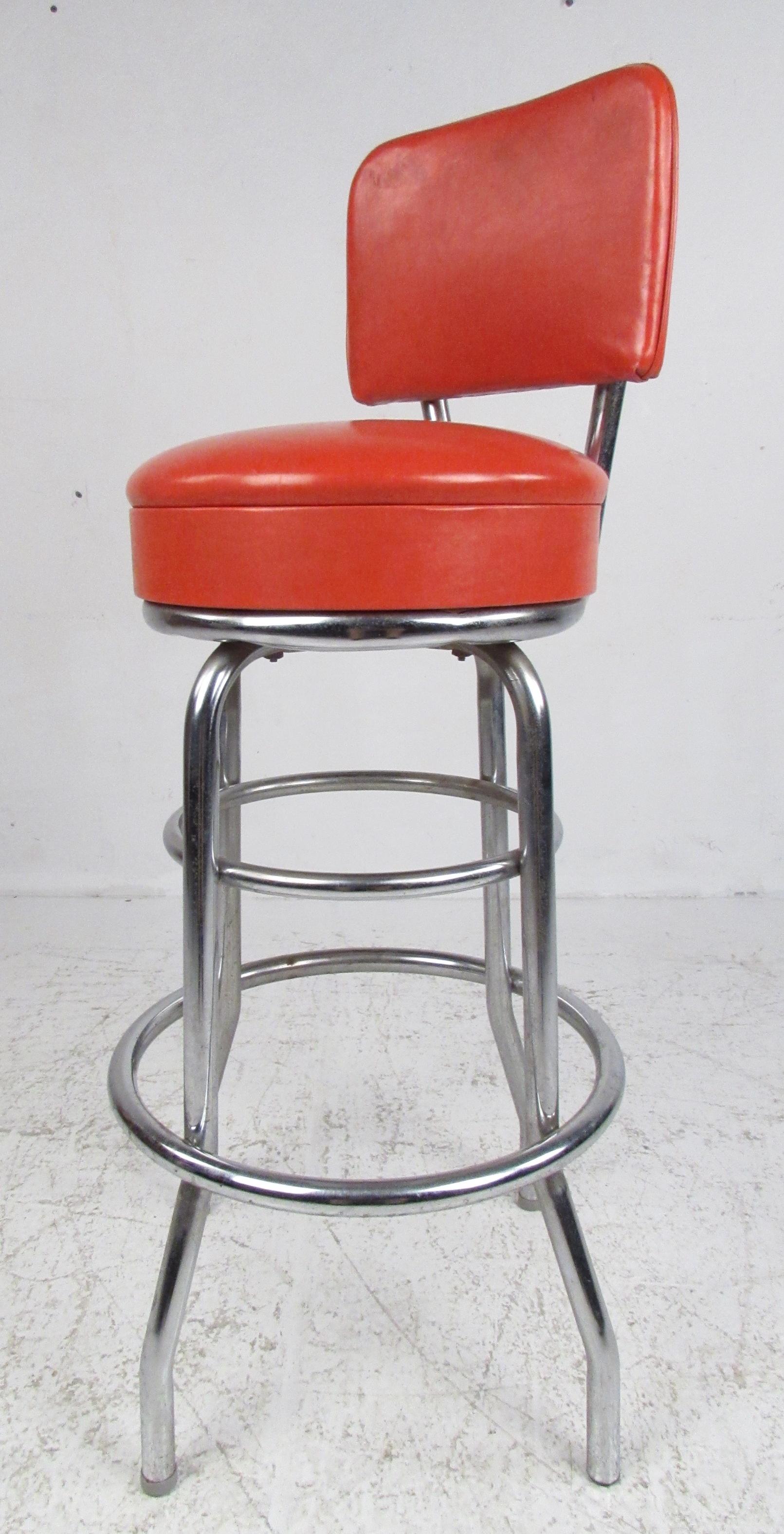 Set of four Mid-Century Modern swivel bar stools by Moreland Dalton Corp., 1969. Very comfortable thick padded seats with wide backrests and splayed legs providing a wide footprint and stabile base. Please confirm item location (NY or NJ) with