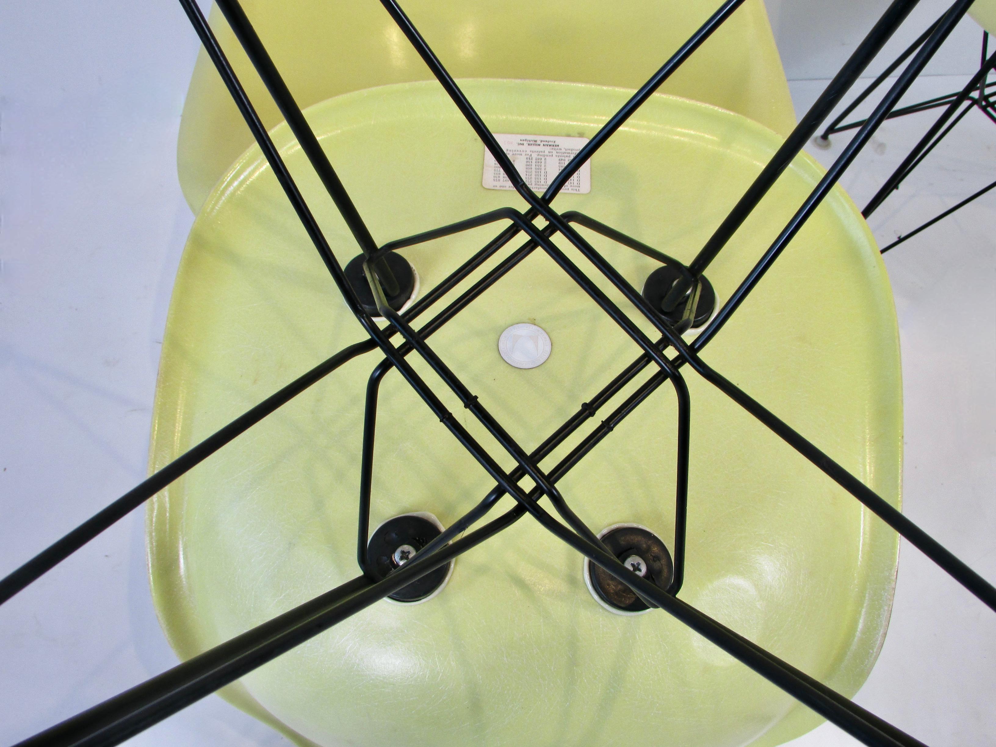Set of Four Vivid Yellow Fiberglass Eames DSR Chairs on Black Eiffel Tower Bases In Good Condition For Sale In Ferndale, MI