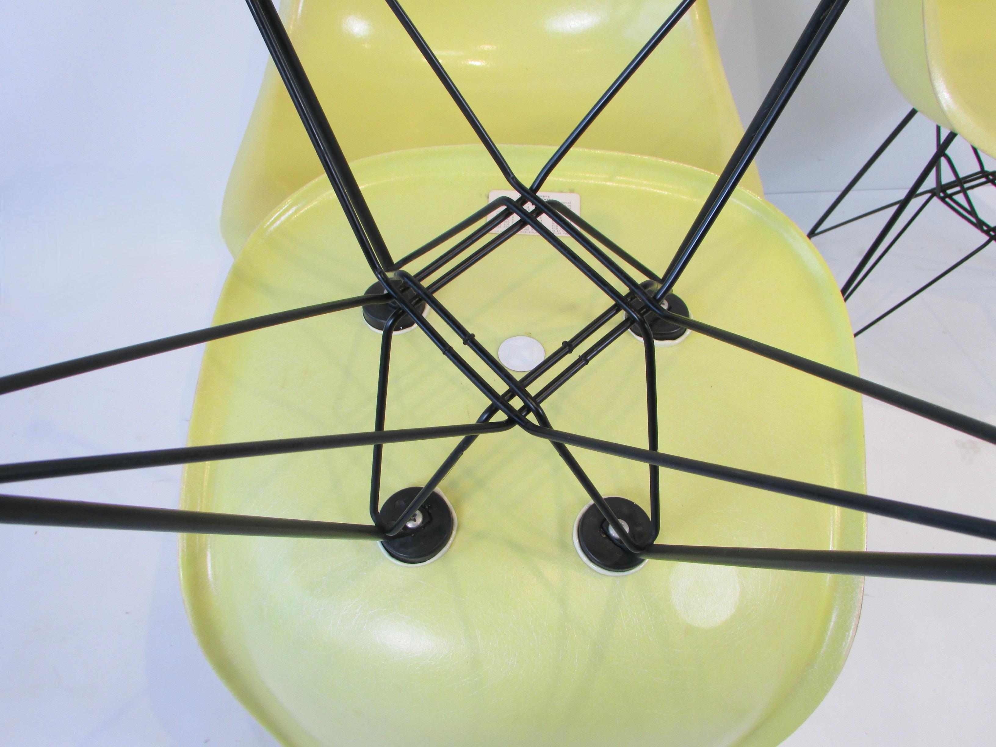 Steel Set of Four Vivid Yellow Fiberglass Eames DSR Chairs on Black Eiffel Tower Bases For Sale