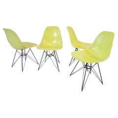 Set of Four Vivid Yellow Fiberglass Eames DSR Chairs on Black Eiffel Tower Bases