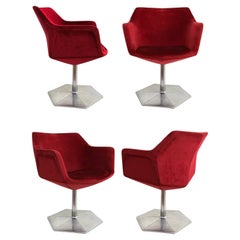 Set of four Voitto Haapalainen “Prisma” swivel chairs with faceted bodies.