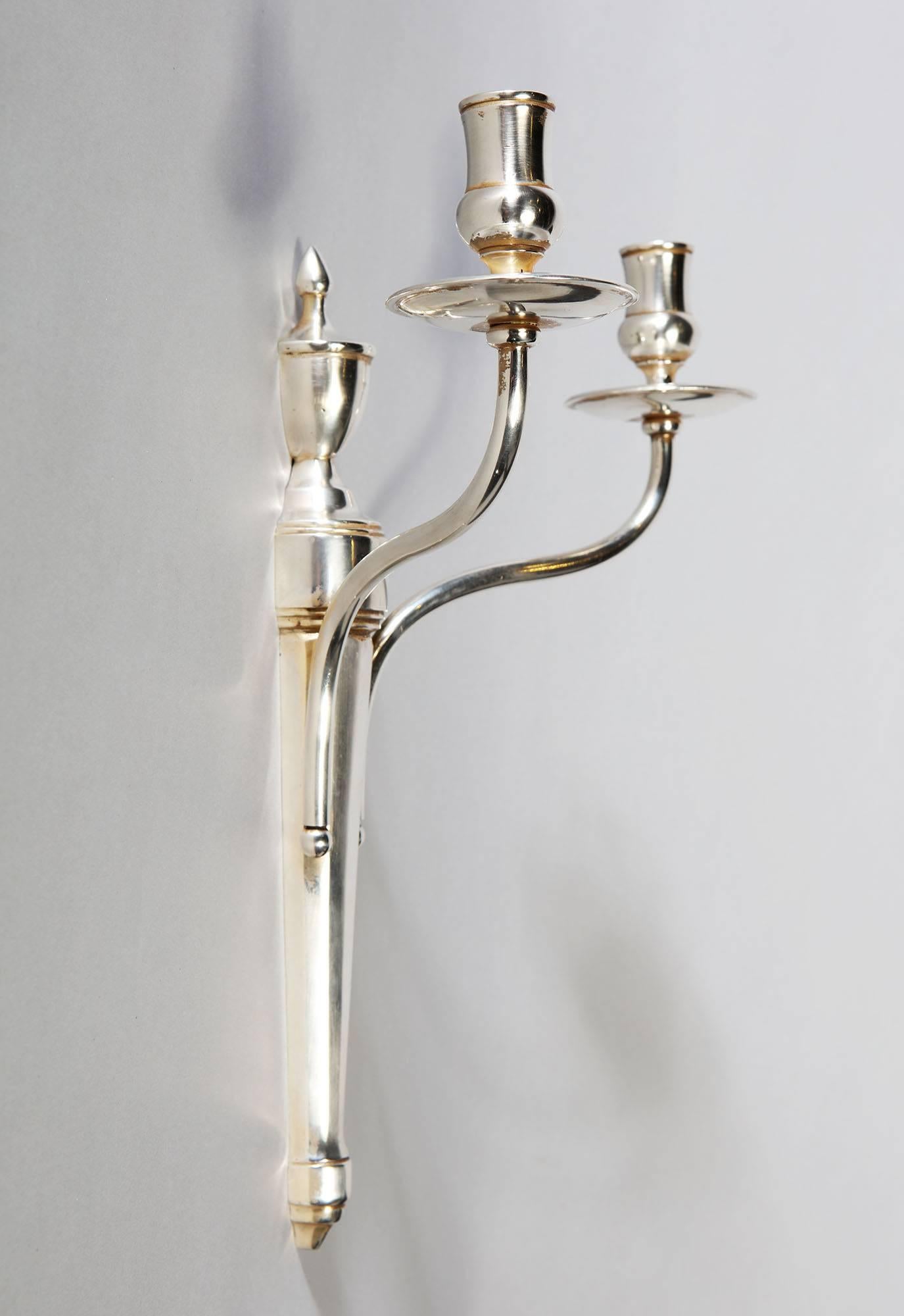 A fine set of four silver plated wall lights, attributed to Maison Jansen.

 