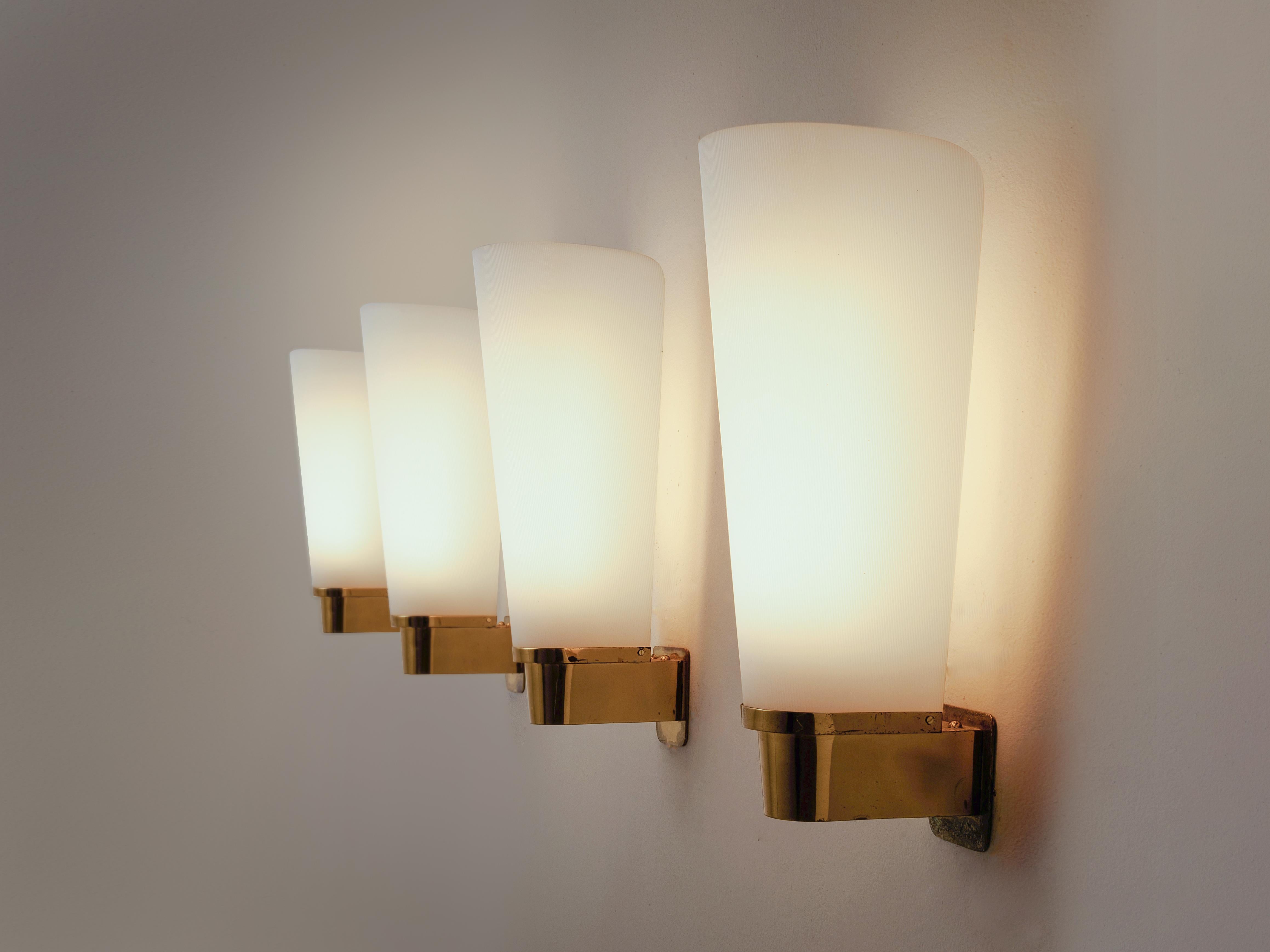 Set of four wall lights, in brass and acrylic, Europe, 1970s

Set of four elegant wall-lights. The wall-mounted fixture is made of brass and shows a nice combination of square and round forms. All with subtle rounded corners. The shade is made of