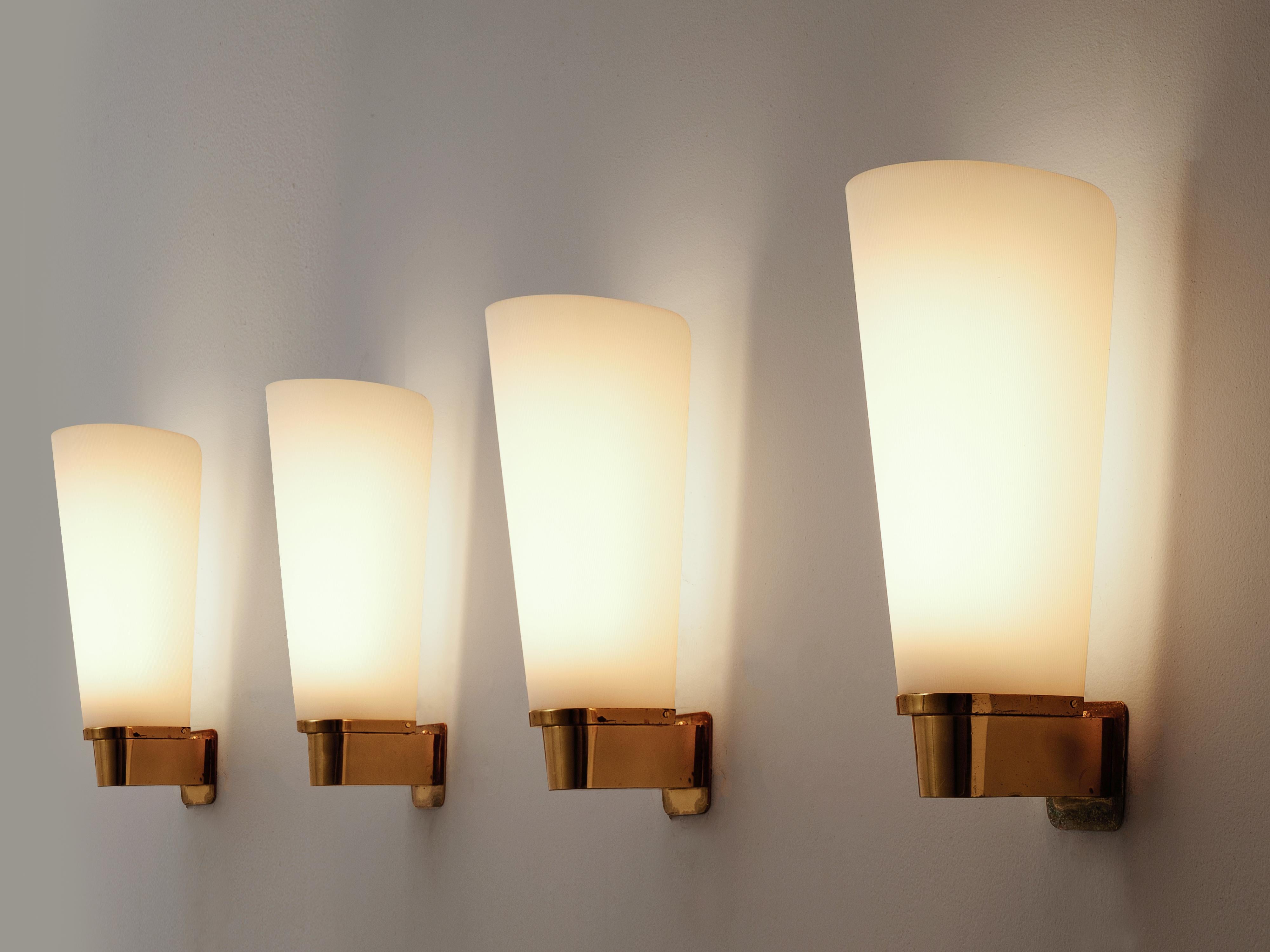 Set of four wall lights, in brass and acrylic, Europe, 1970s

Set of four elegant wall-lights. The wall-mounted fixture is made of brass and shows a nice combination of square and round forms. All with subtle rounded corners. The shade is made of