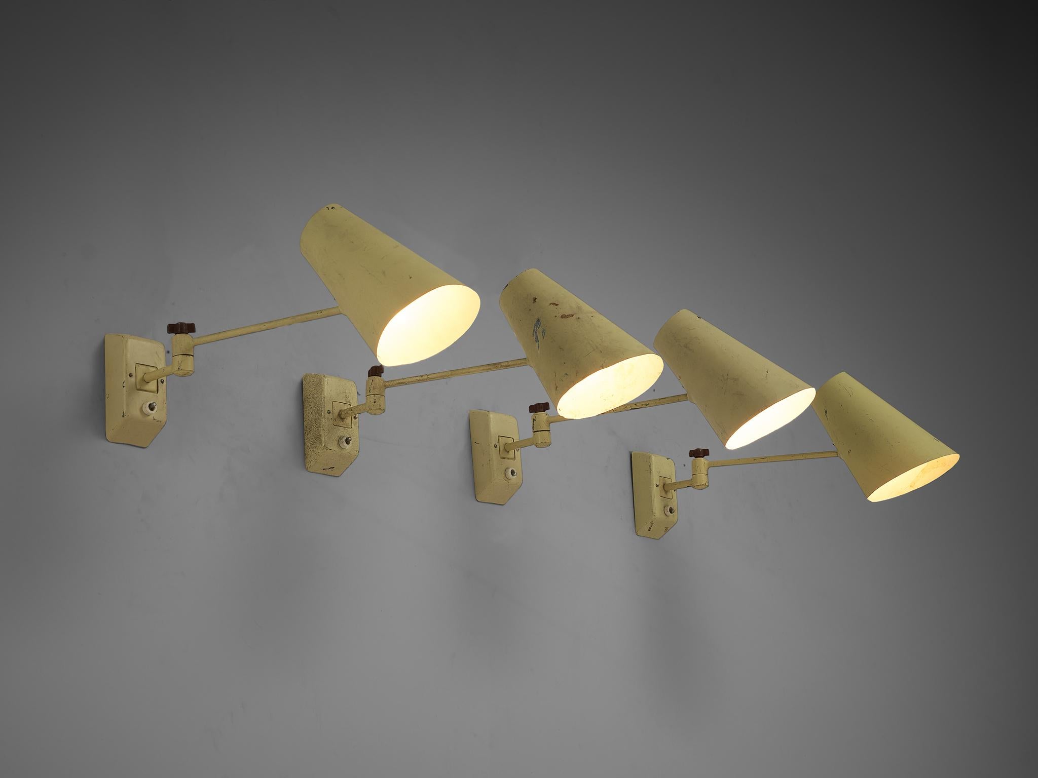 Set of four wall lights, lacquered metal, Europe, 1950s

Simple and modest mid century wall lights in pale yellow. These lights are made in lacquered metal with adjustable rods and shades. The base of the lamps is attached to the wall and the light