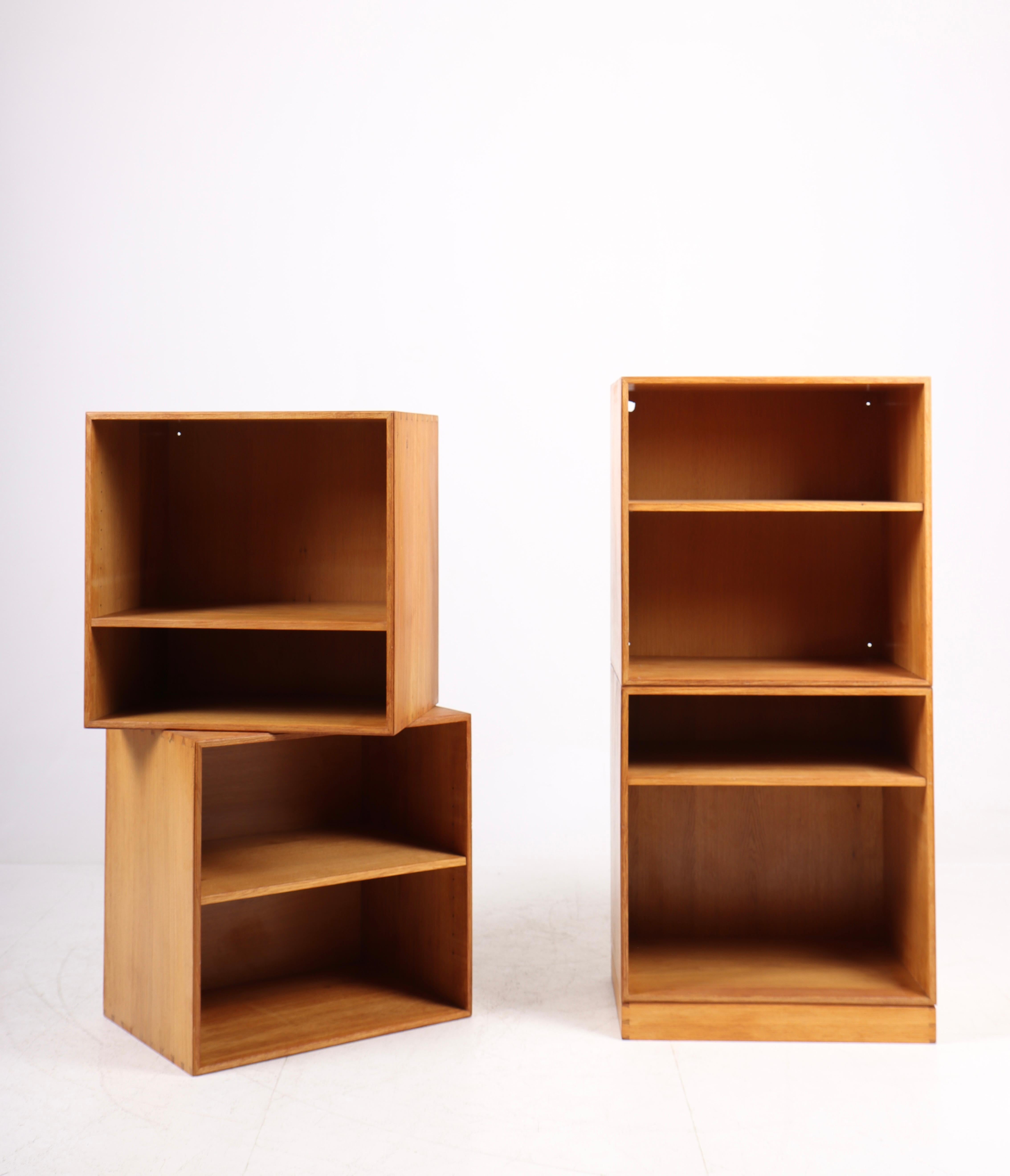 Set of four wall-mounted bookcases in solid oak. Designed and made in Denmark. Original condition.