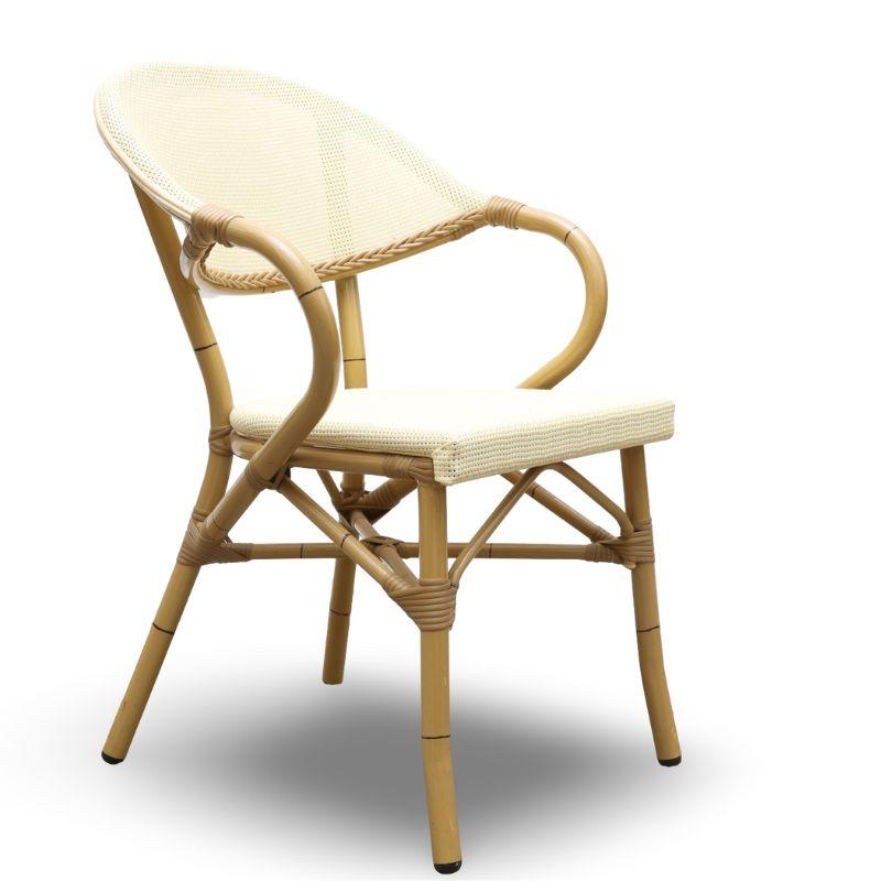 A set of four Walters Wicker outdoor aluminum, faux bamboo bistro armchairs. The seats and backs are a neutral mesh which complements the tan faux bamboo curved frames. A stylish addition to your patio. 