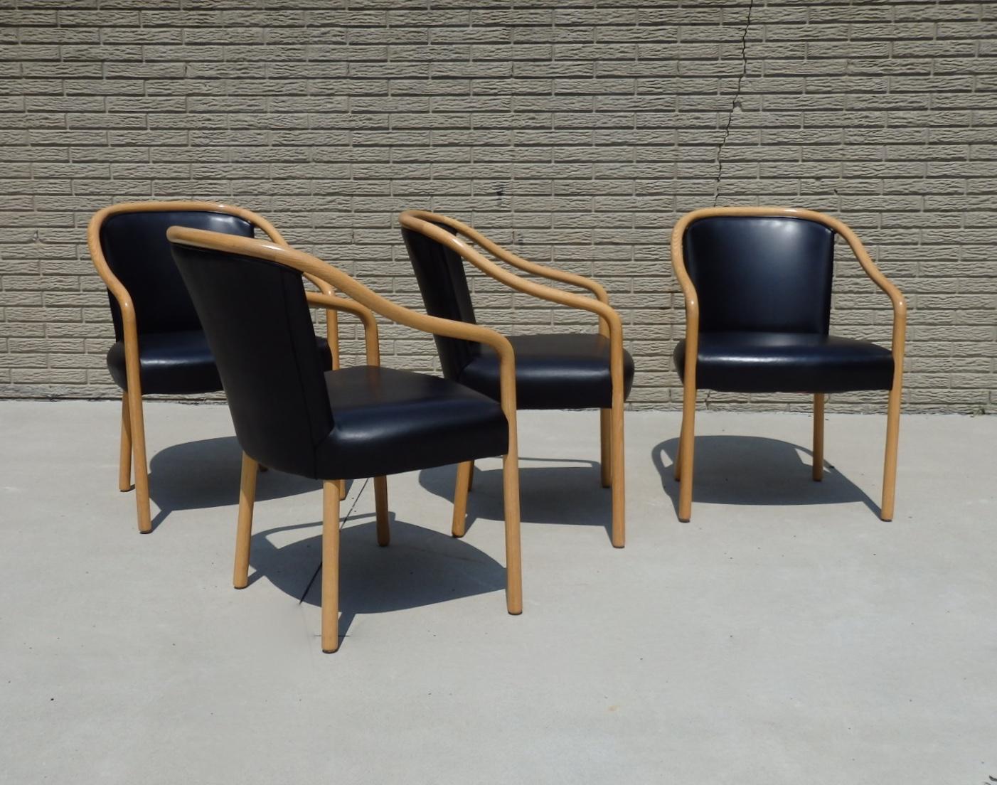Set of four ash frame chairs upholstered in black leather. Designed by Ward Bennet for Brickel Associates. Condition is superb.